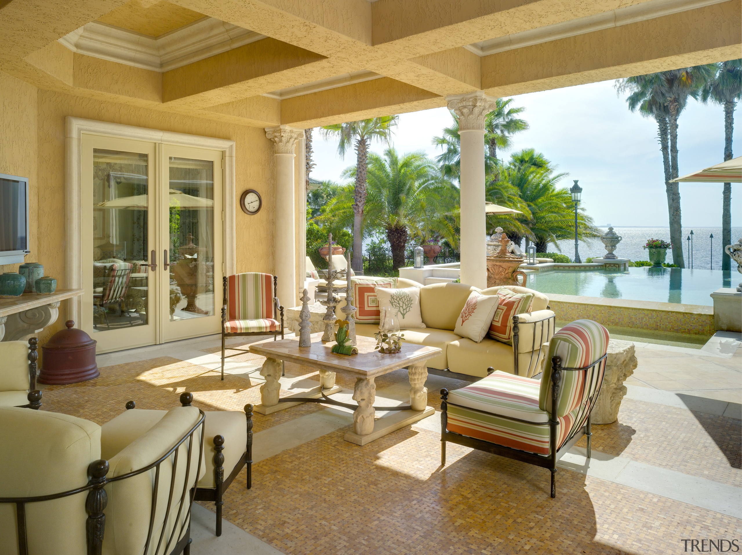 view of covered outdoor living area in this estate, home, interior design, living room, property, real estate, resort, window, orange, brown