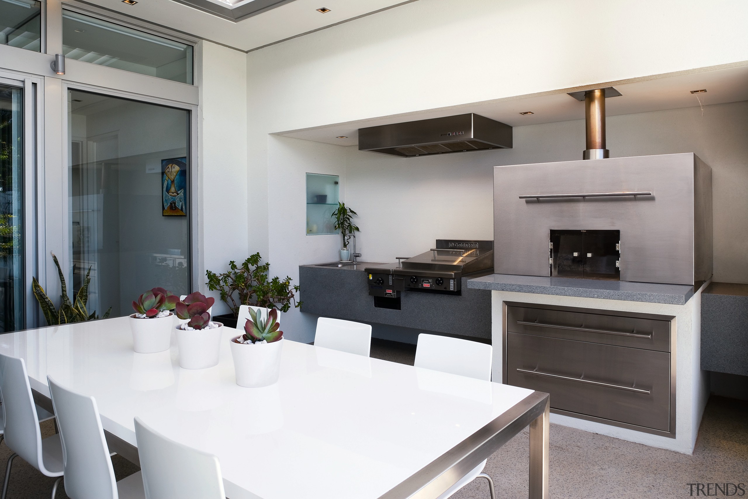 view of the outdoor kitchen featuring stainless steel countertop, interior design, kitchen, real estate, white, gray