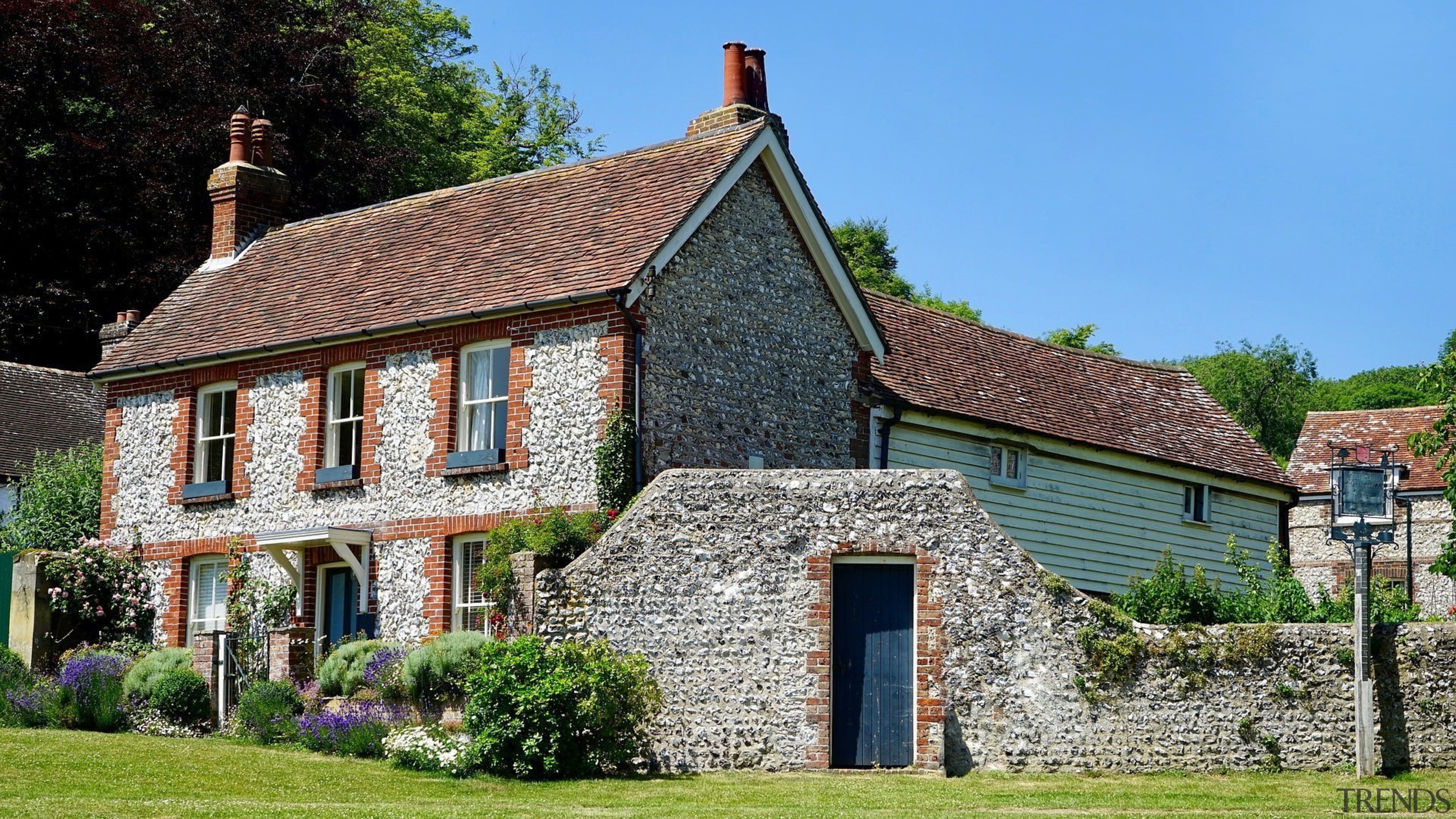 An outside view of a traditional British home almshouse, building, cottage, estate, facade, farmhouse, home, house, mansion, property, real estate