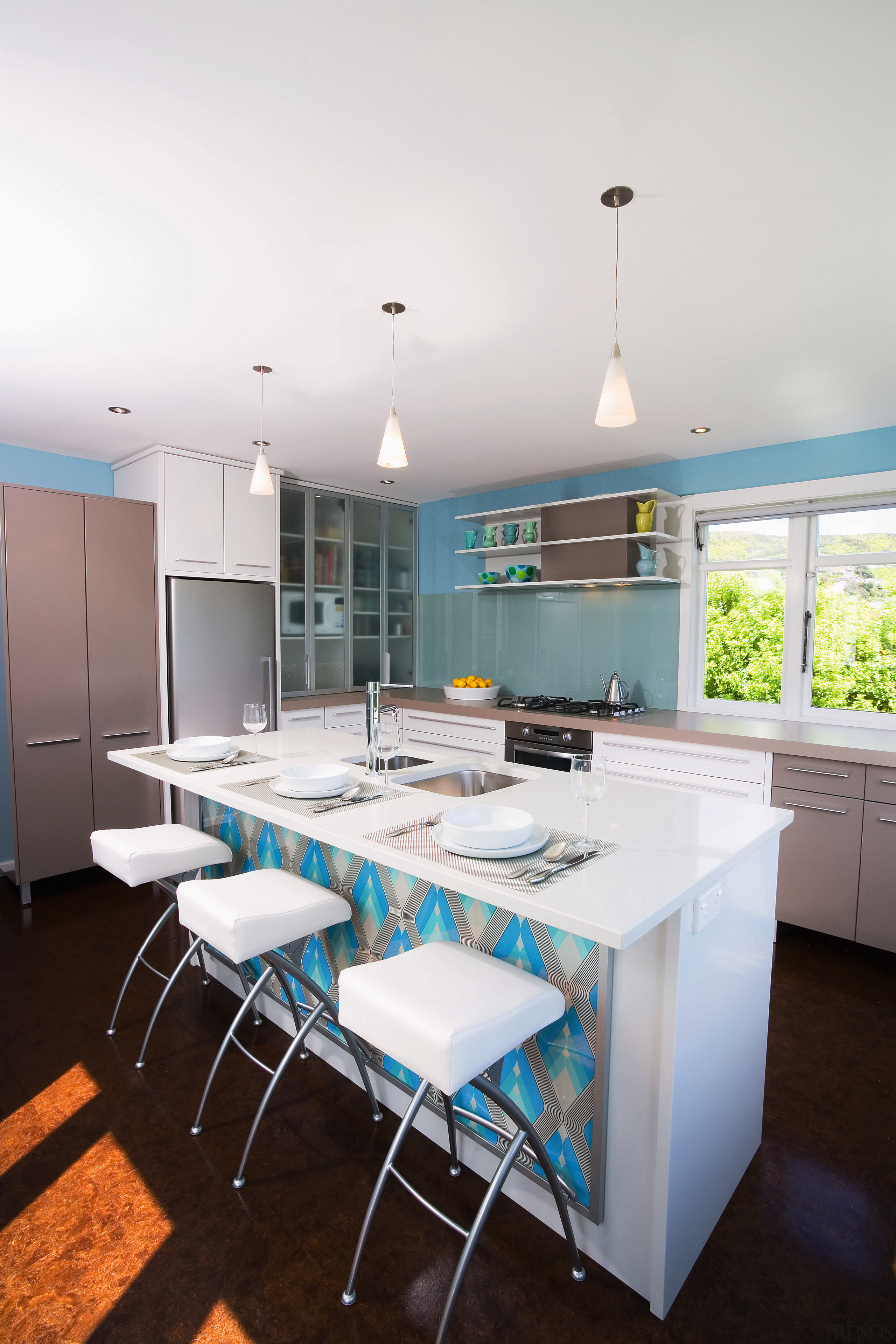 view of the kitchen featuring blum kitchen cabinetry, countertop, daylighting, interior design, kitchen, real estate, room, table, white