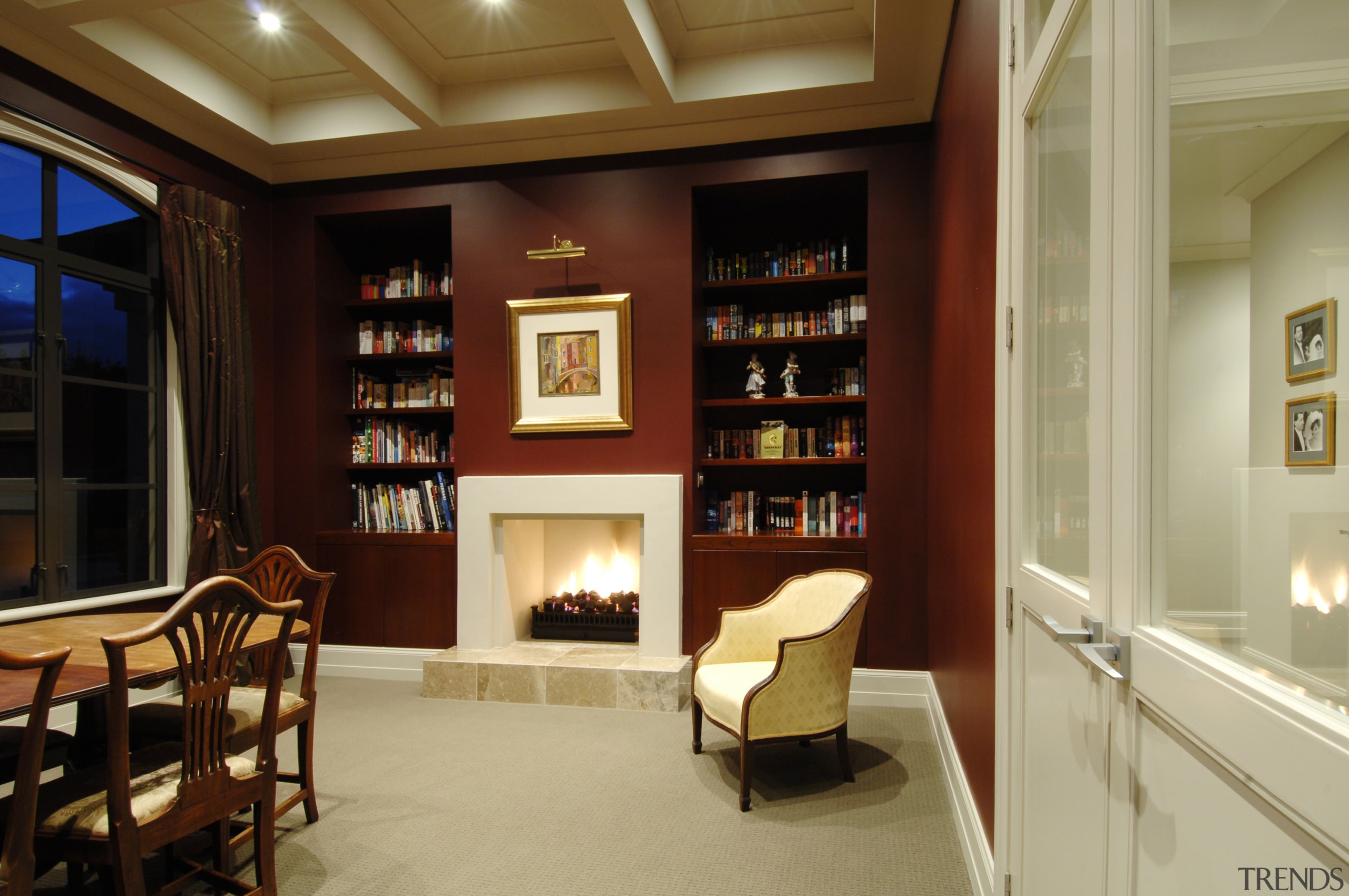 This house was designed by Mark Wilson of bookcase, ceiling, interior design, living room, lobby, shelving, orange, brown