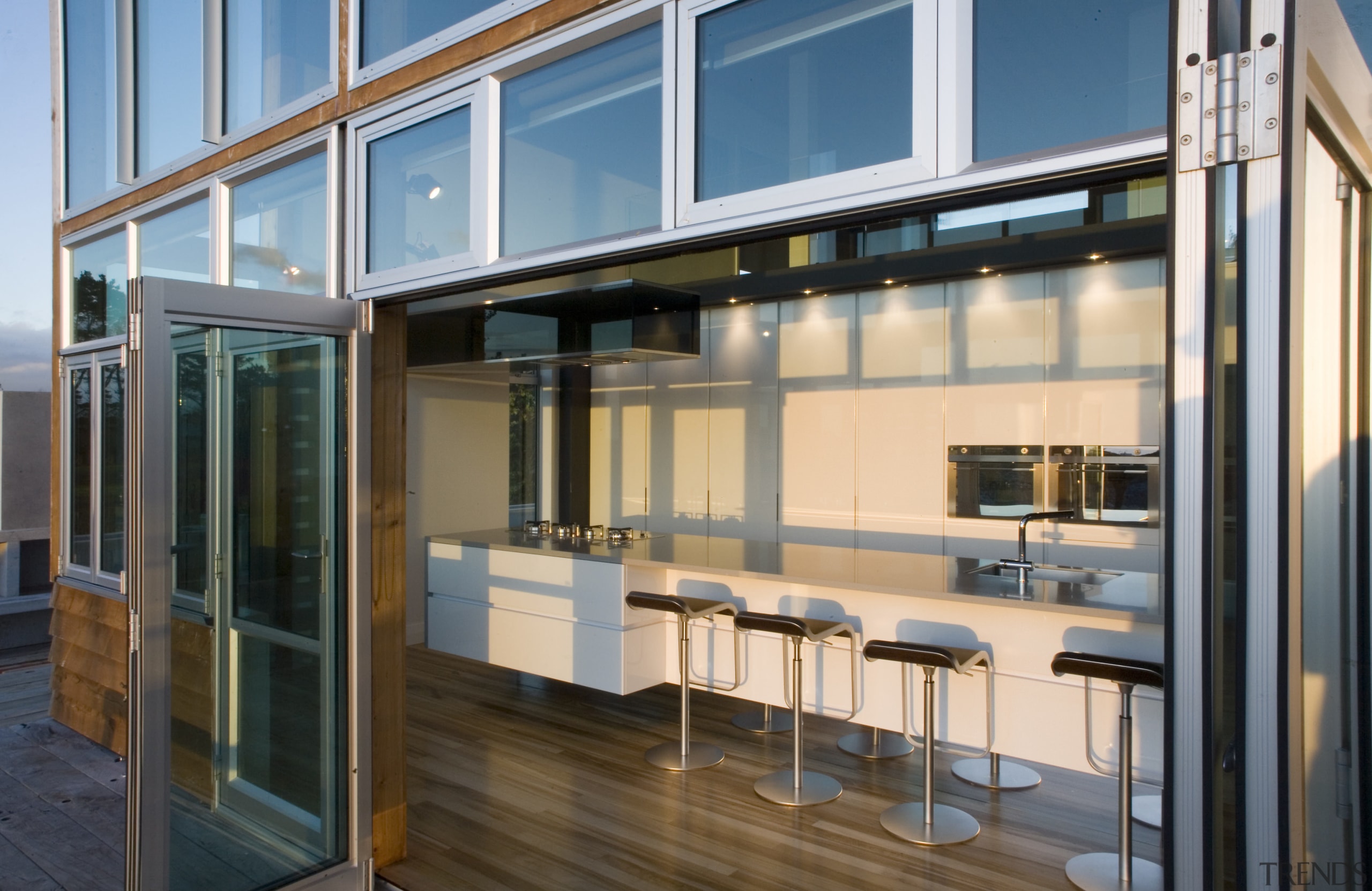 View of a kitchen designed by NKBA designer daylighting, door, glass, window