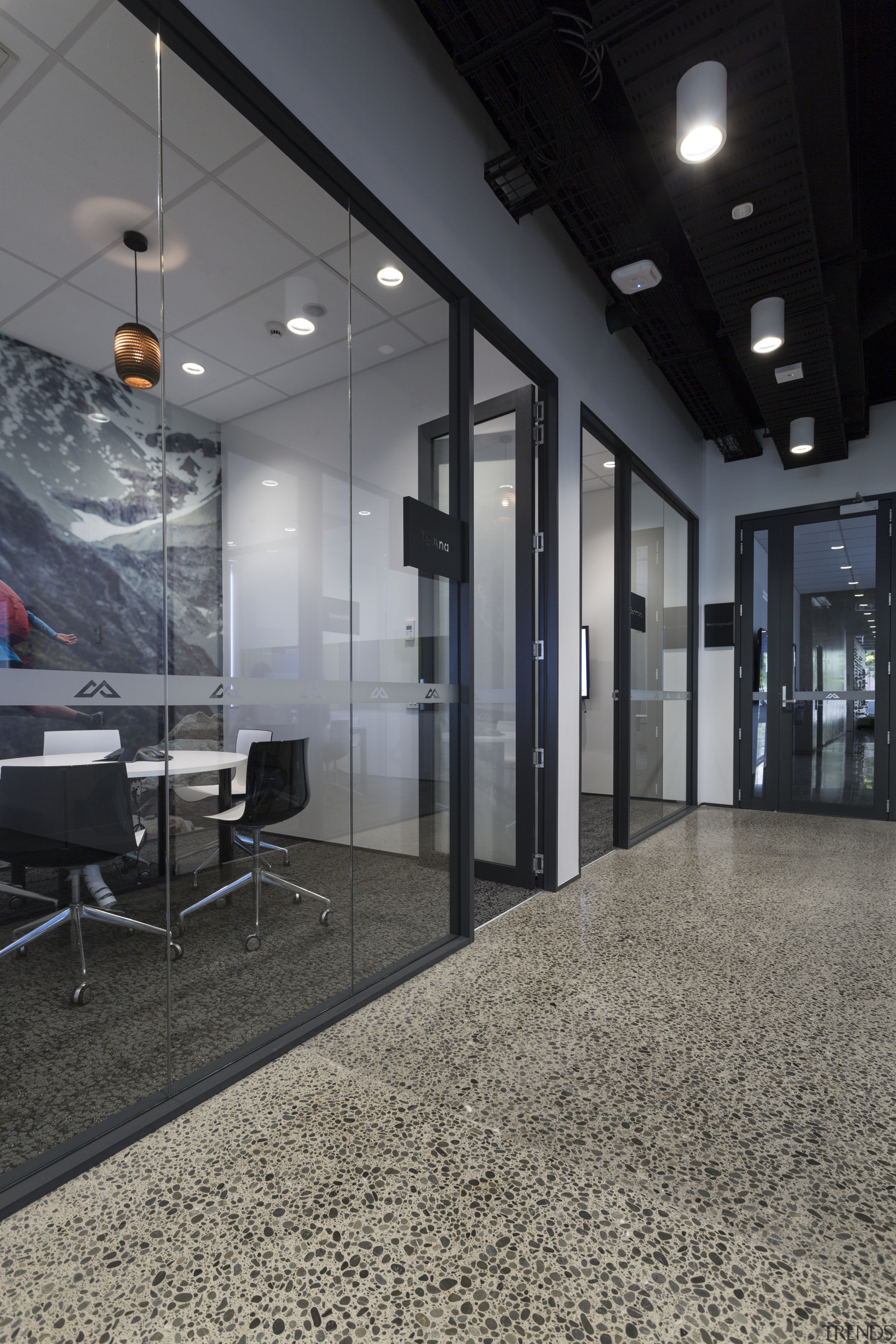 A glass-fronted and photo-backed meeting room at the architecture, ceiling, floor, flooring, glass, interior design, lobby, wall, gray, black