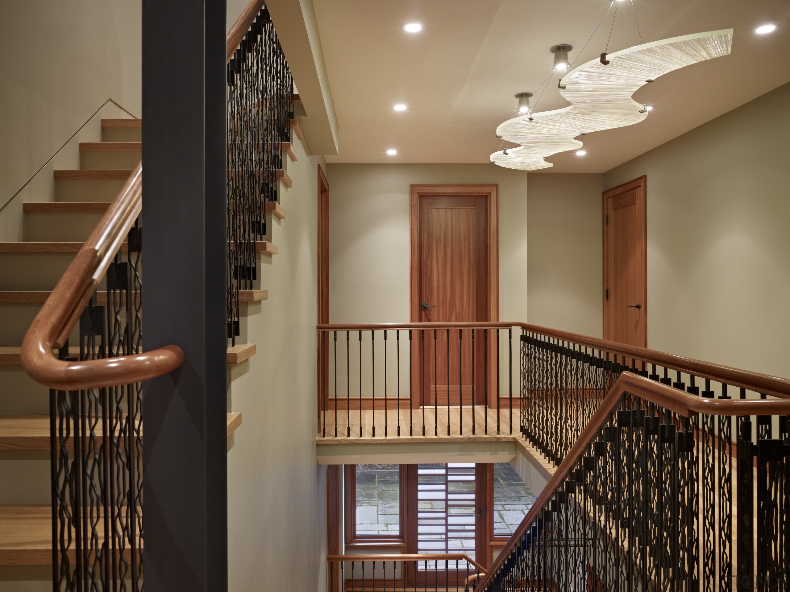 Staircases up and down from second story. - baluster, ceiling, estate, floor, flooring, handrail, hardwood, home, interior design, lobby, property, real estate, room, stairs, wall, window, wood, brown, black