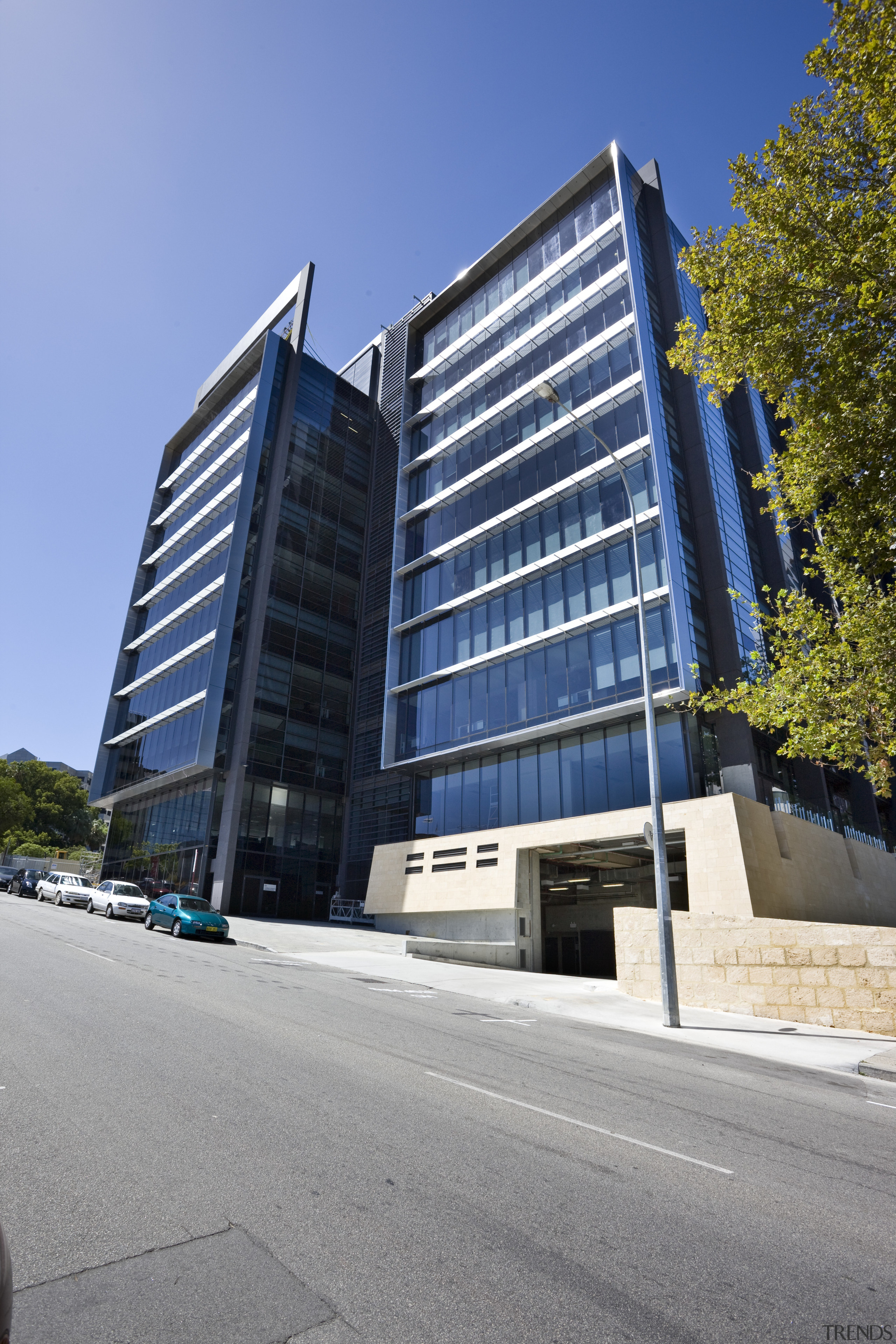 Exterior view of the eco-friendly commercial office tower apartment, architecture, building, commercial building, condominium, corporate headquarters, daytime, facade, headquarters, house, metropolitan area, mixed use, neighbourhood, property, real estate, residential area, sky, skyscraper, tower block, urban area, gray