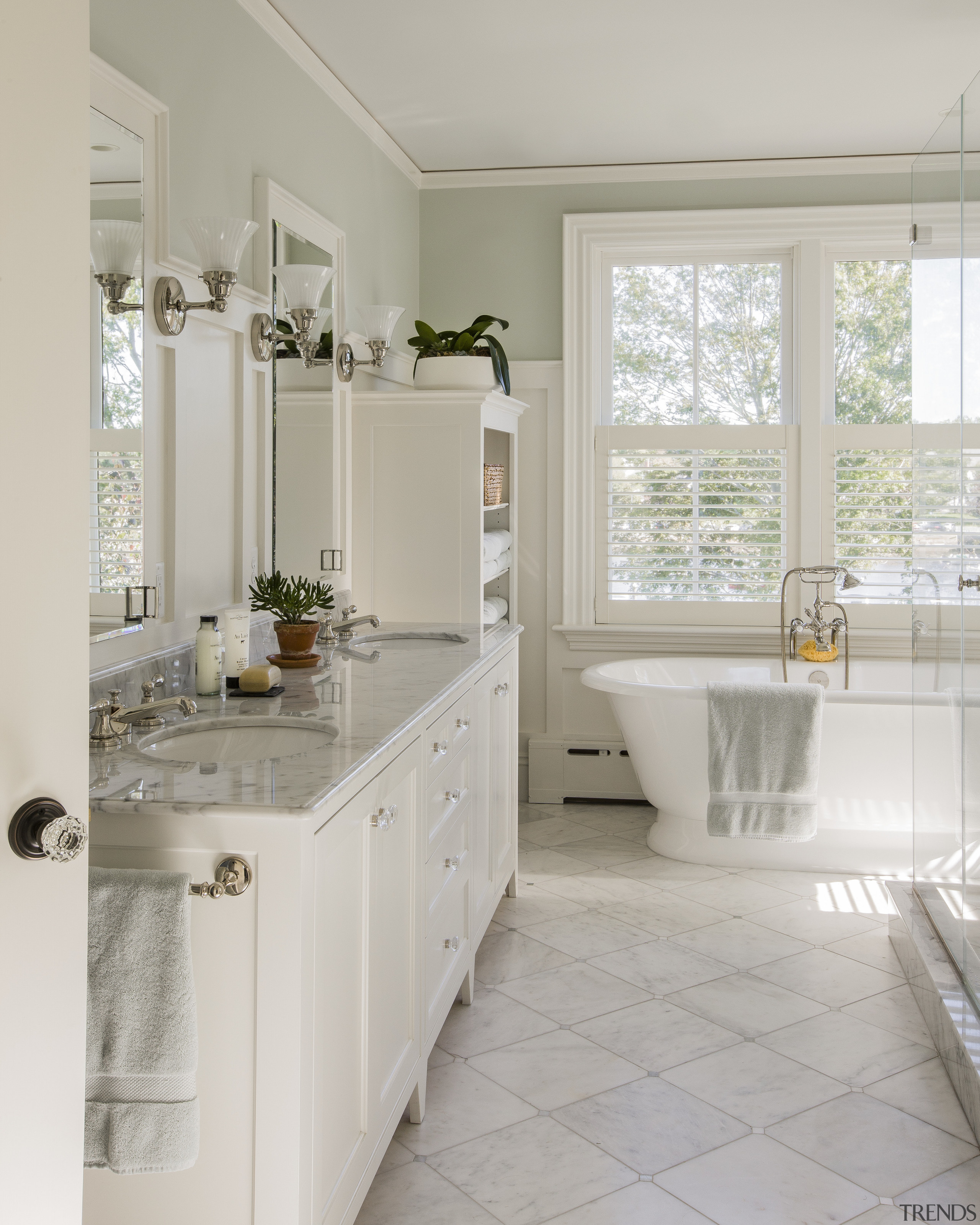 This master bathroom, in a new addition to bathroom, bathroom accessory, bathroom cabinet, countertop, cuisine classique, floor, home, interior design, kitchen, real estate, room, sink, tile, window, gray