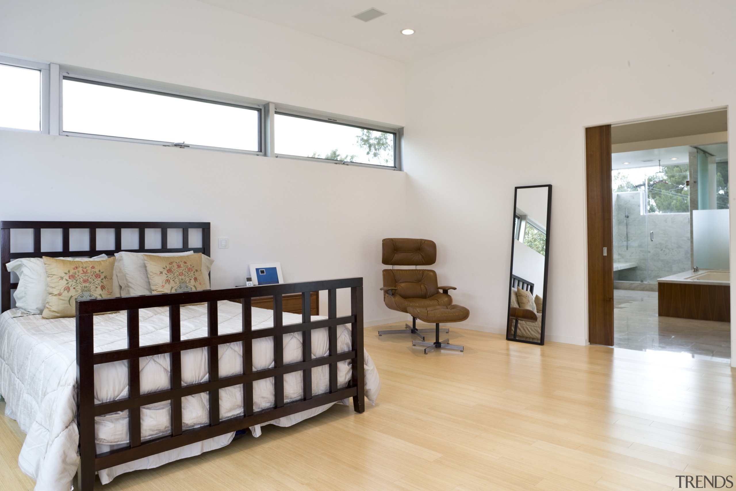 View of the master bedroom which features bedroom estate, floor, flooring, hardwood, home, interior design, living room, product, property, real estate, room, window, wood, wood flooring, white