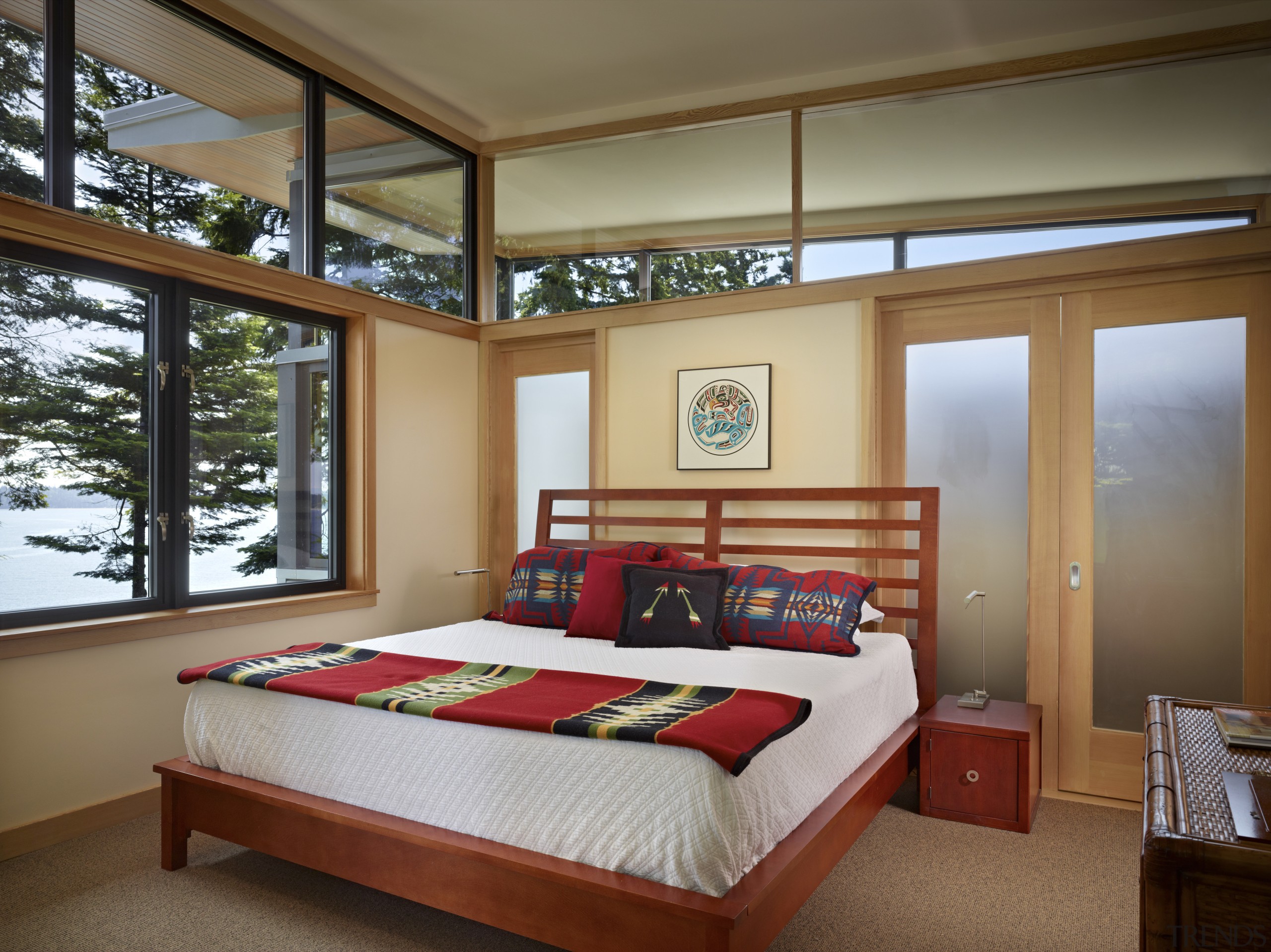 The master bedroom in this waterfront house has architecture, bed frame, bedroom, ceiling, estate, home, interior design, real estate, room, window, wood, brown