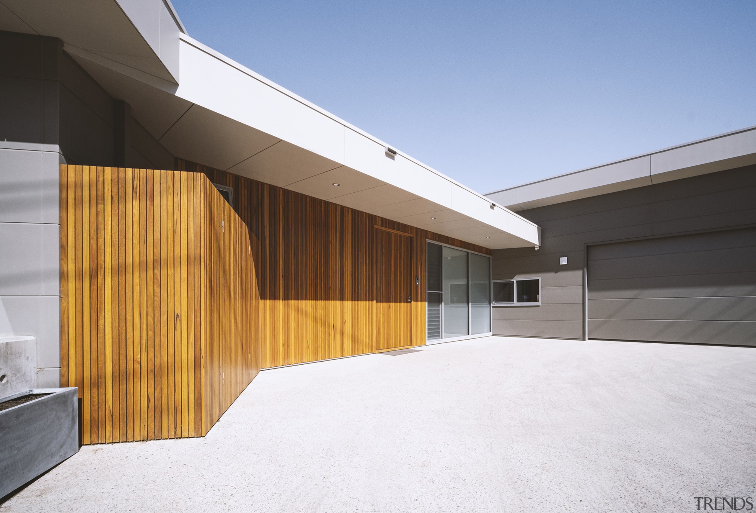 Warm timber cladding welcomes you to the entry 