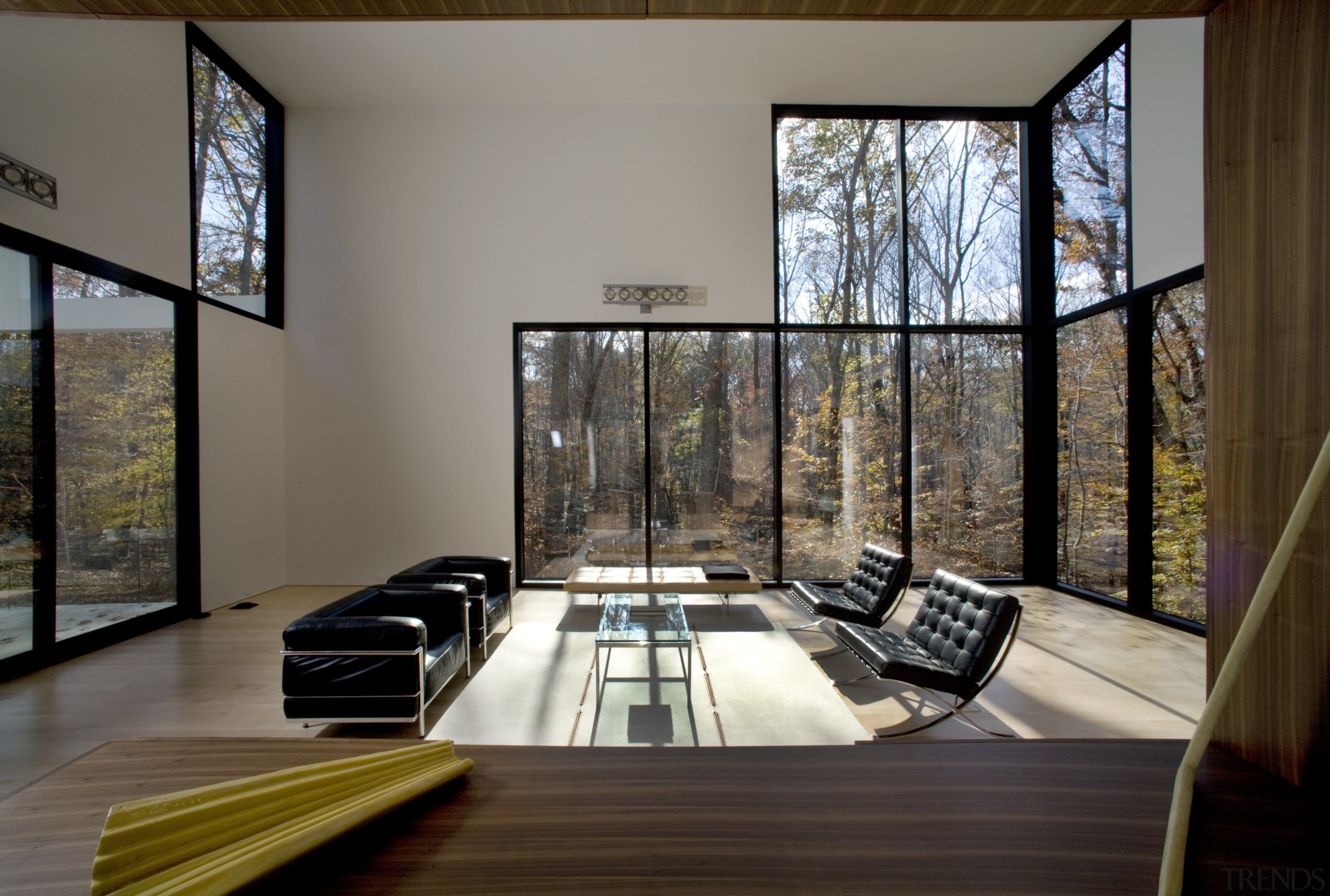 View of living area that features maple flooring, architecture, daylighting, home, house, interior design, living room, property, real estate, window, wood, gray, brown