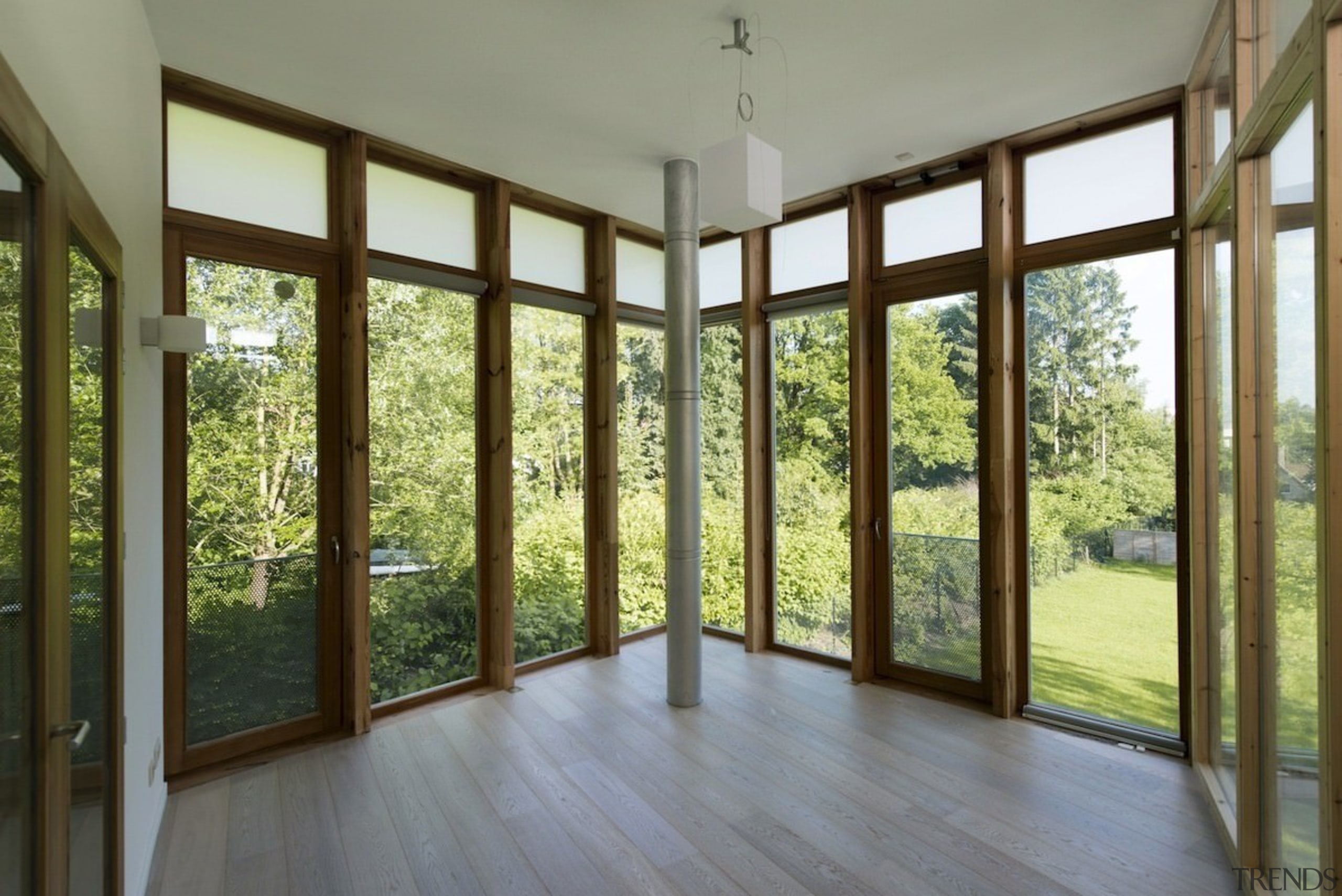 There's little separating this living area from the daylighting, door, estate, home, house, interior design, property, real estate, window, gray, brown