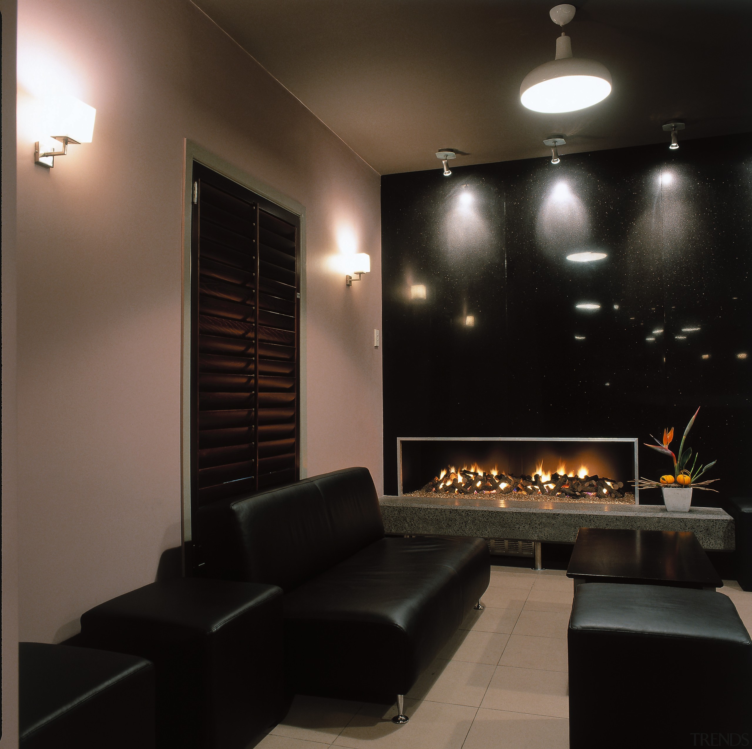 image of chill out area consisting of leater ceiling, interior design, light fixture, lighting, living room, wall, black