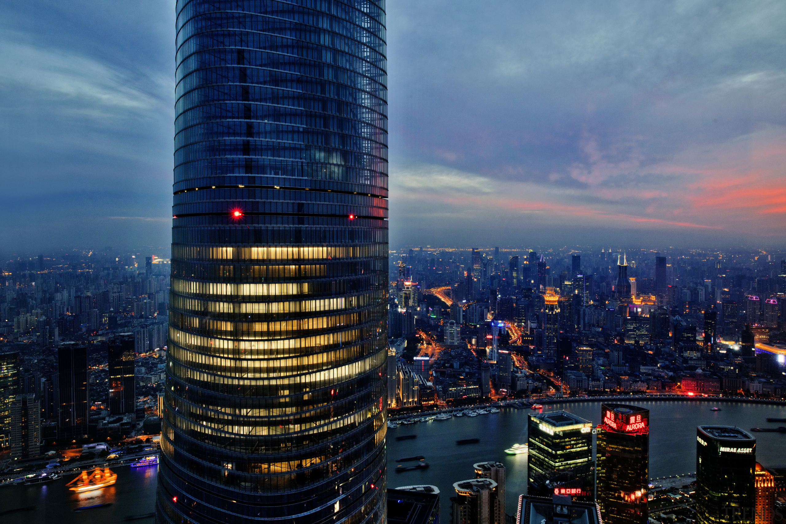 Sited in the Pudong financial hub, the twisting aerial photography, bird's eye view, building, city, cityscape, daytime, downtown, dusk, evening, landmark, metropolis, metropolitan area, night, sky, skyline, skyscraper, tourist attraction, tower, tower block, urban area, blue