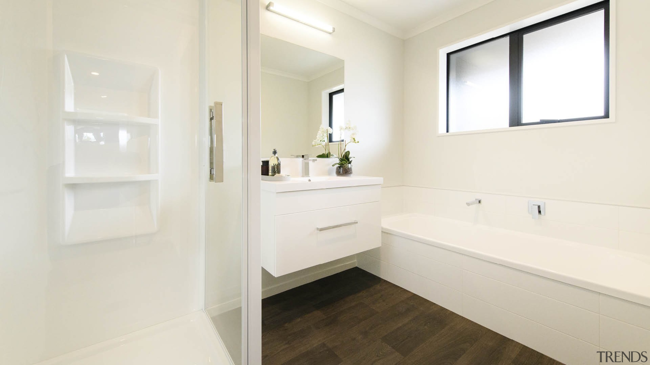 Timber look flooring also features in the home's 