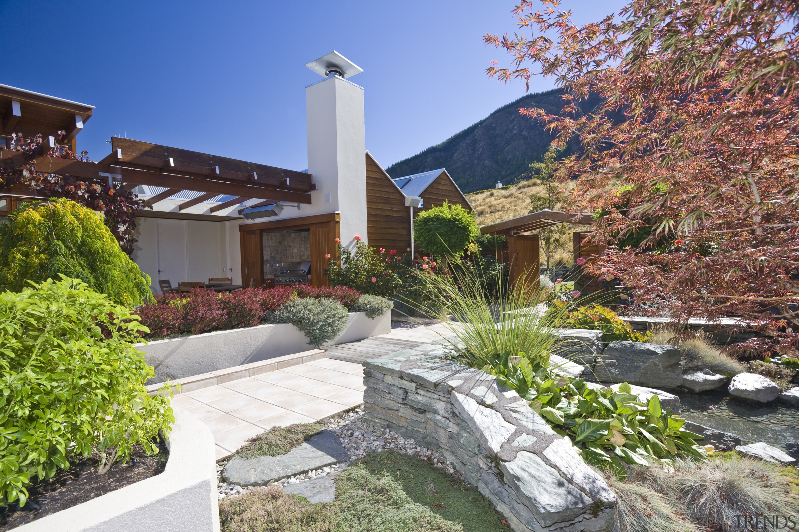 Exterior view of the courtyard which features covered backyard, cottage, estate, garden, home, house, landscape, landscaping, outdoor structure, plant, property, real estate, residential area, yard