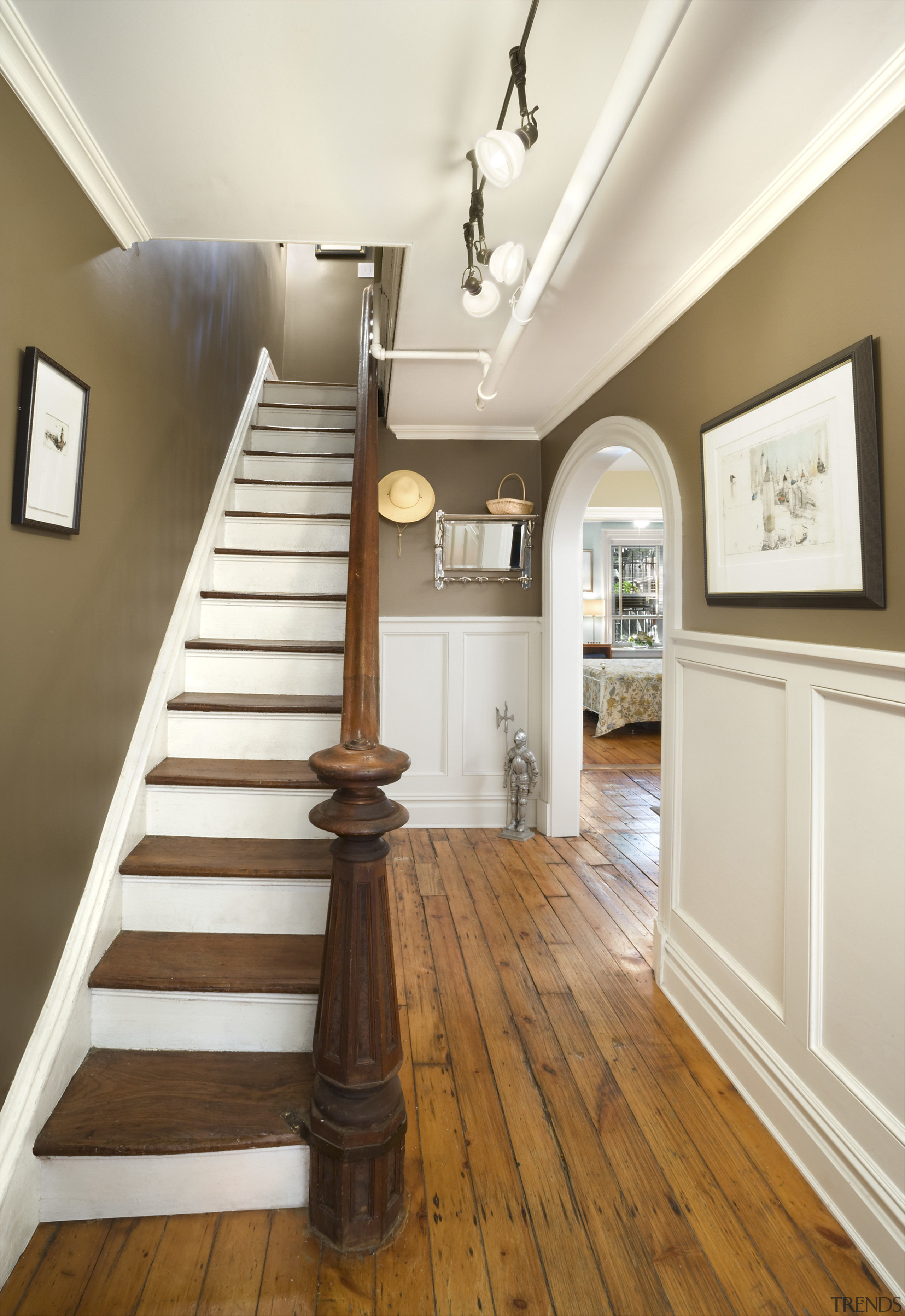 View of a staircase which features timber steps, ceiling, daylighting, dining room, floor, flooring, hall, handrail, hardwood, home, interior design, laminate flooring, molding, real estate, room, stairs, wall, wood, wood flooring, wood stain, white, brown