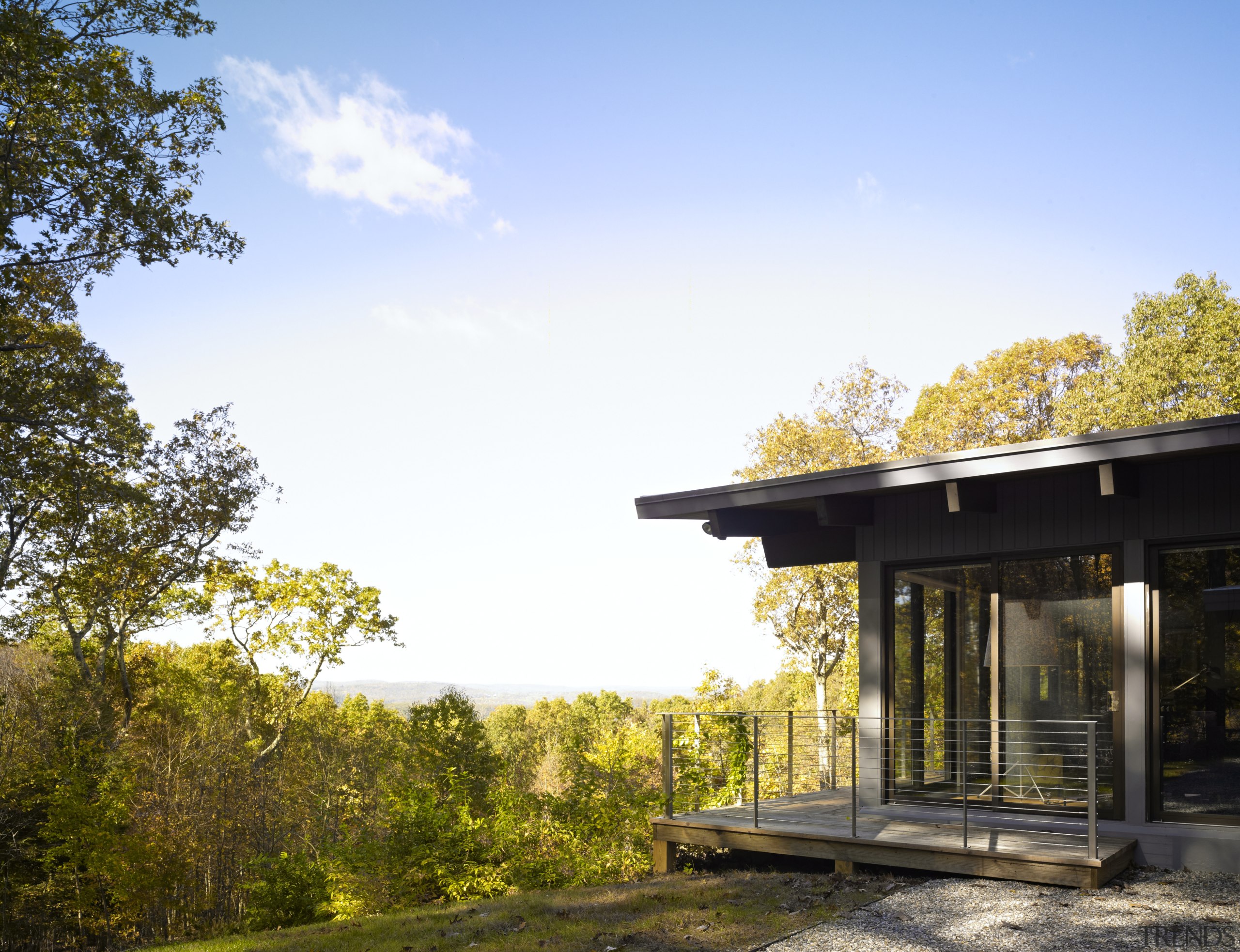 updated this 1960s house for his own familys architecture, autumn, cloud, cottage, estate, home, house, landscape, leaf, morning, plant, real estate, sky, sunlight, tree, teal, brown