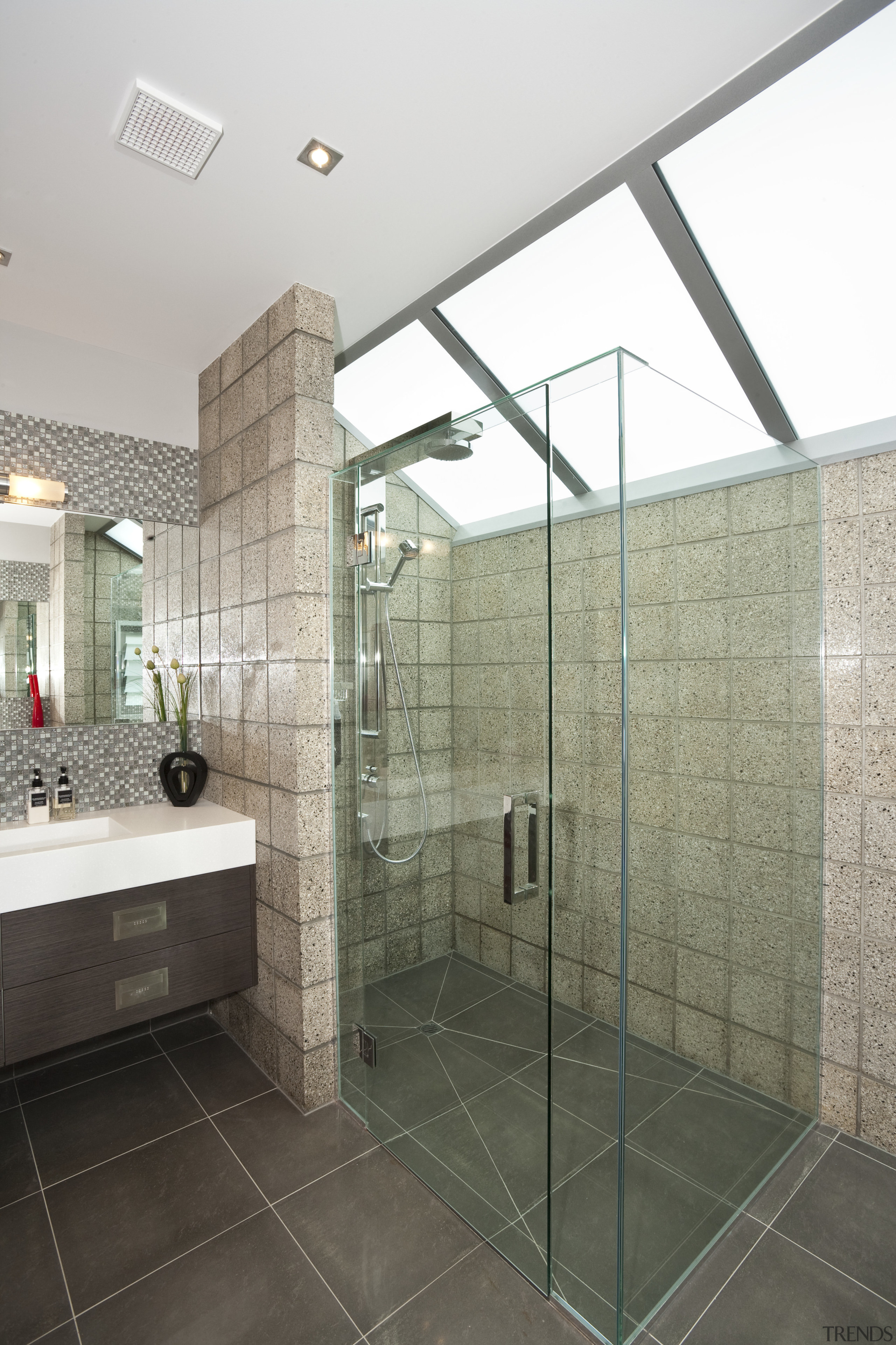 view of the bathroom in a home built architecture, bathroom, daylighting, floor, glass, interior design, plumbing fixture, real estate, room, tile, wall, gray, white