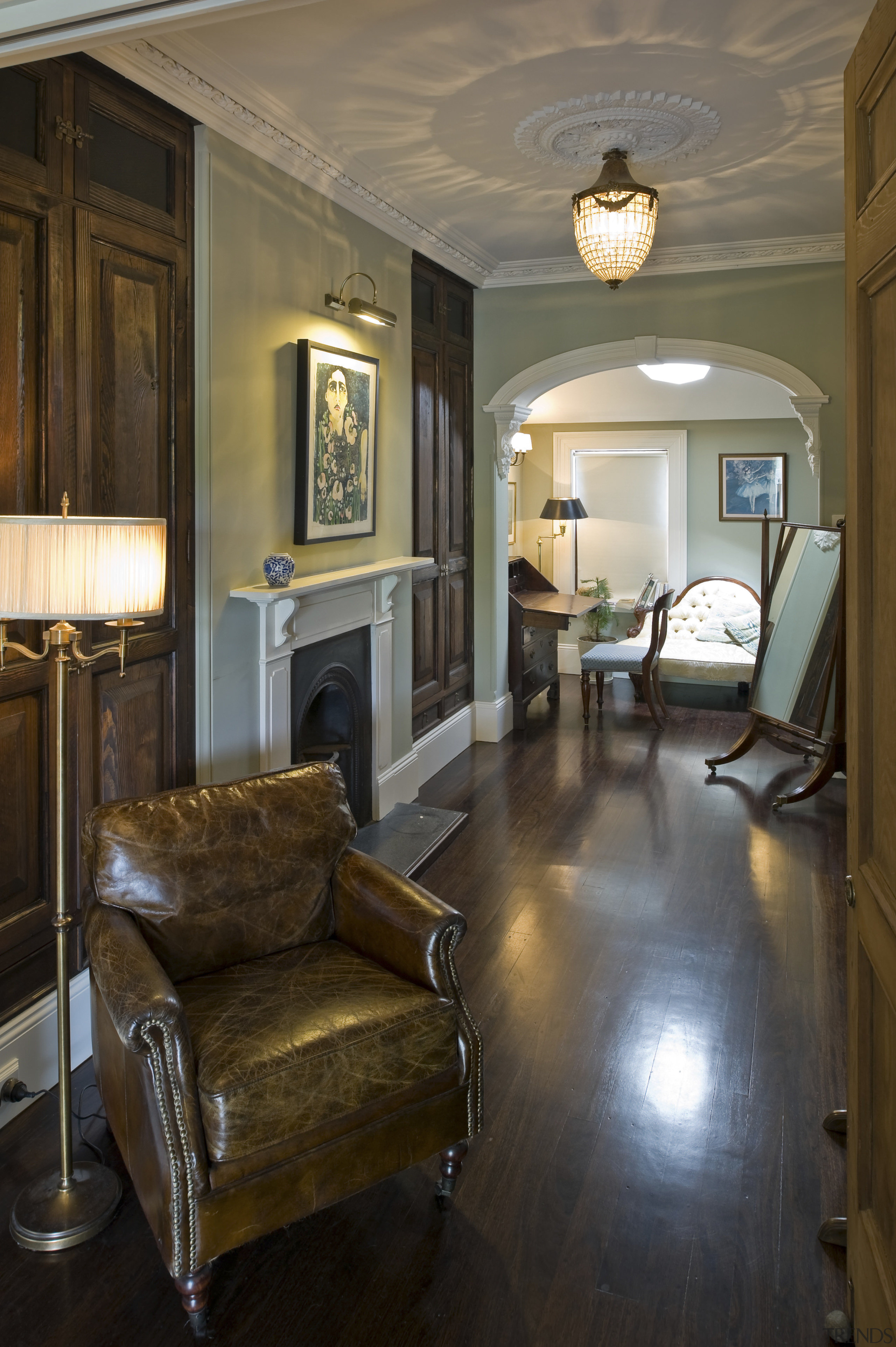 The home was renovated by Maddalena Vienna of ceiling, estate, floor, flooring, hardwood, home, house, interior design, living room, real estate, room, window, wood, wood flooring, brown, black