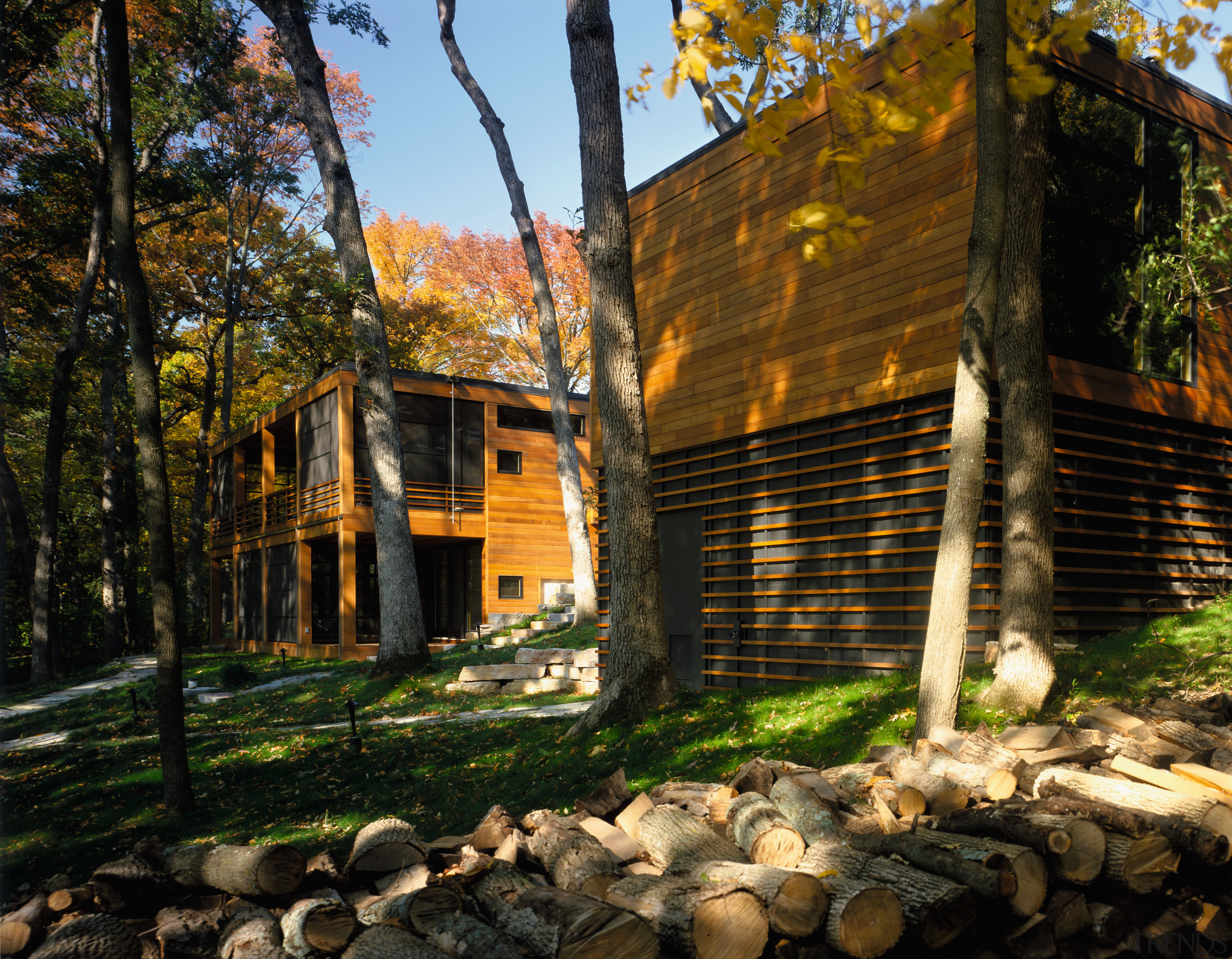 view of the holiday home and garage that autumn, cottage, home, house, landscape, leaf, log cabin, plant, property, real estate, tree, wood, black, brown