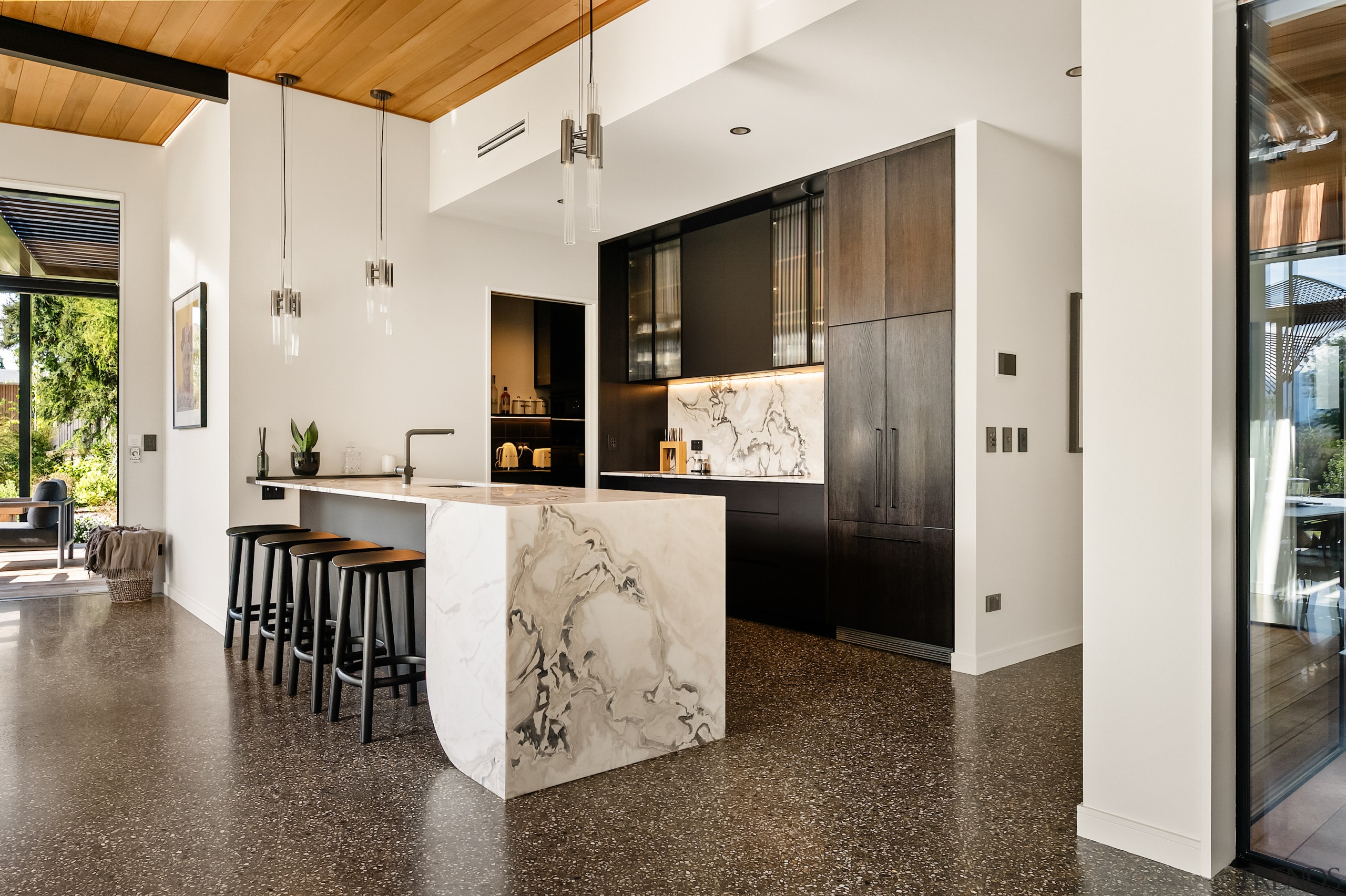 The kitchen is set back within the architecture 