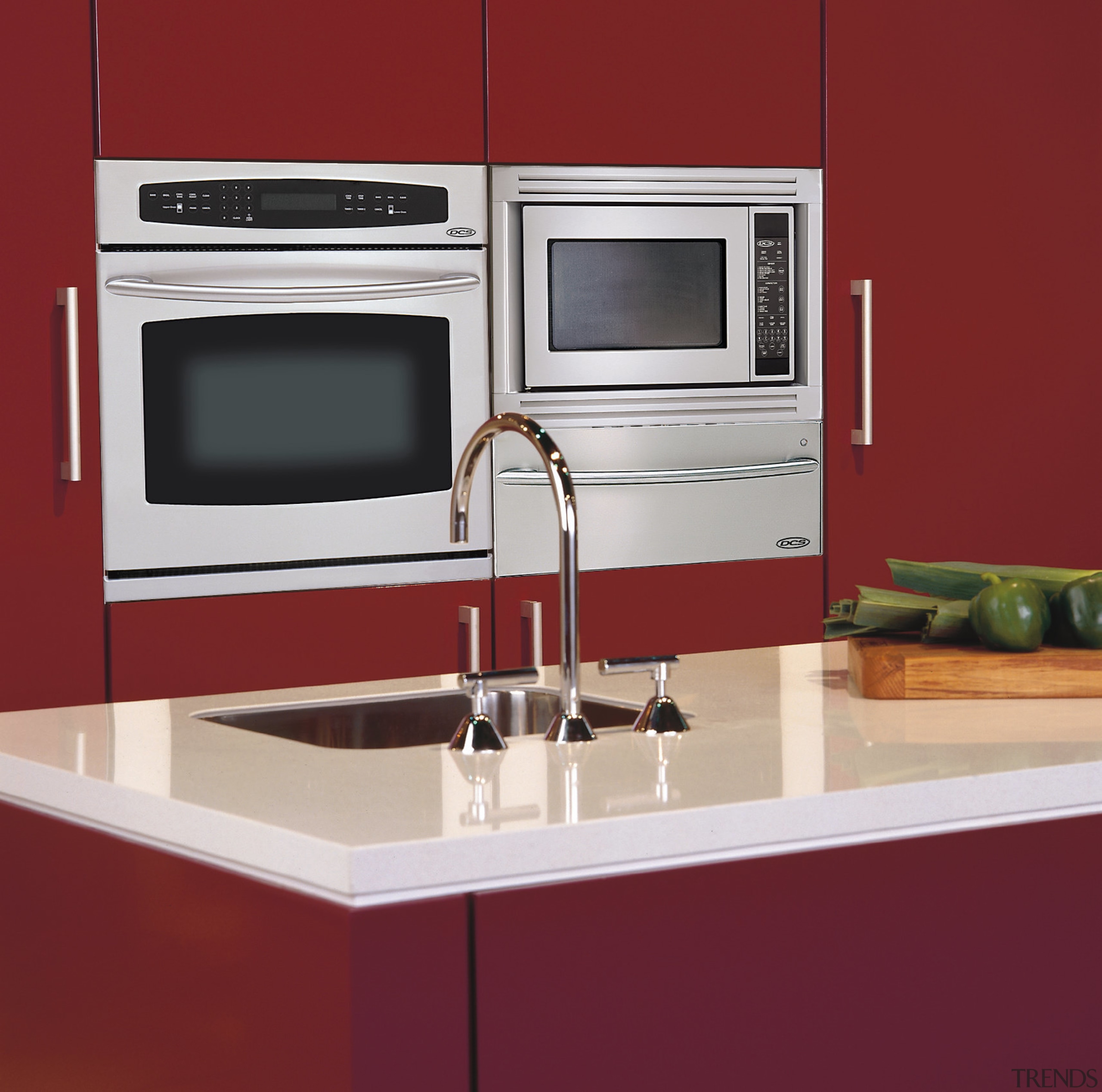 View of a kitchen, red cabinetry, white benchtop, countertop, home appliance, kitchen, kitchen appliance, kitchen stove, major appliance, microwave oven, product design, sink, red