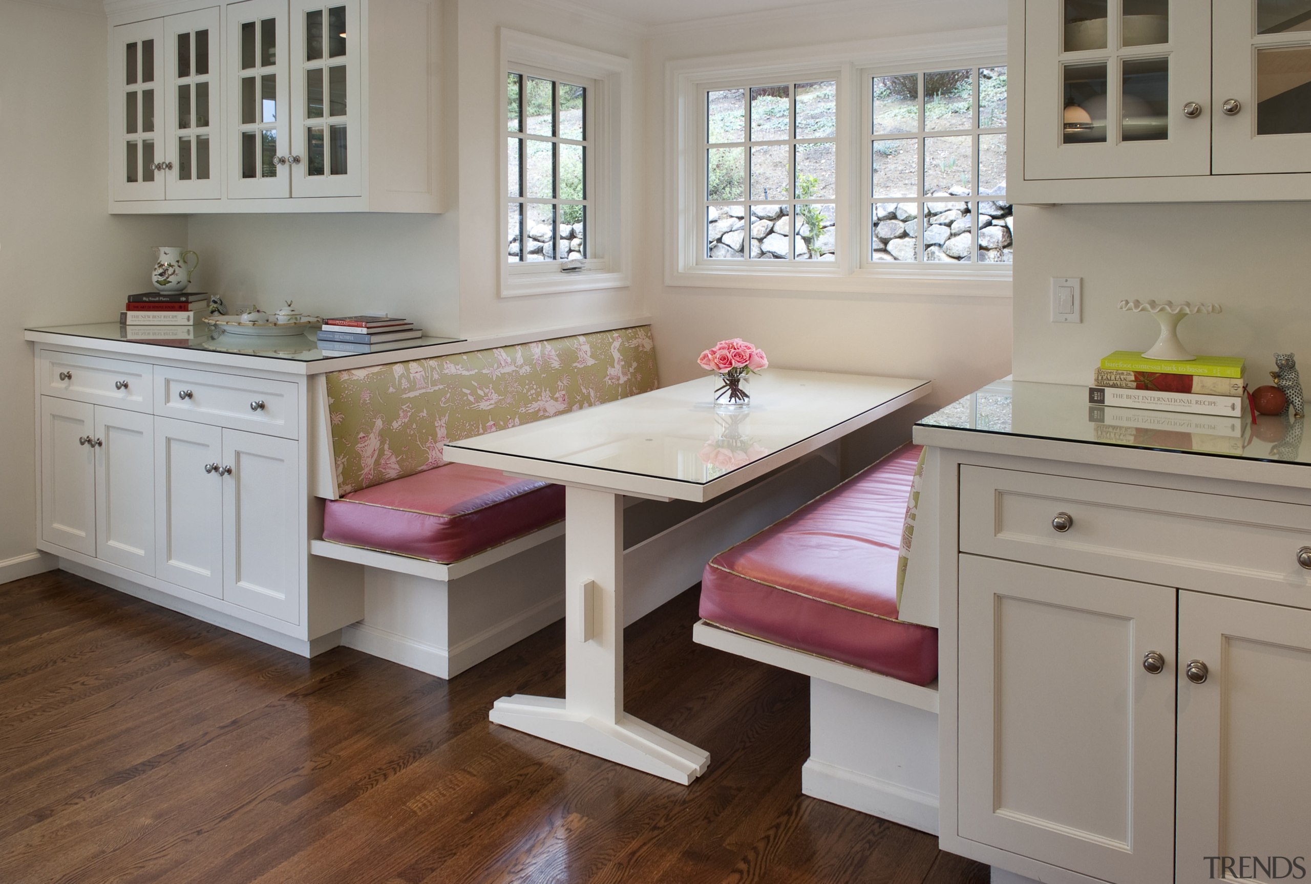 window seat with pink cushions, two seats face cabinetry, countertop, cuisine classique, floor, flooring, furniture, hardwood, home, interior design, kitchen, room, table, window, wood, wood flooring, gray, brown