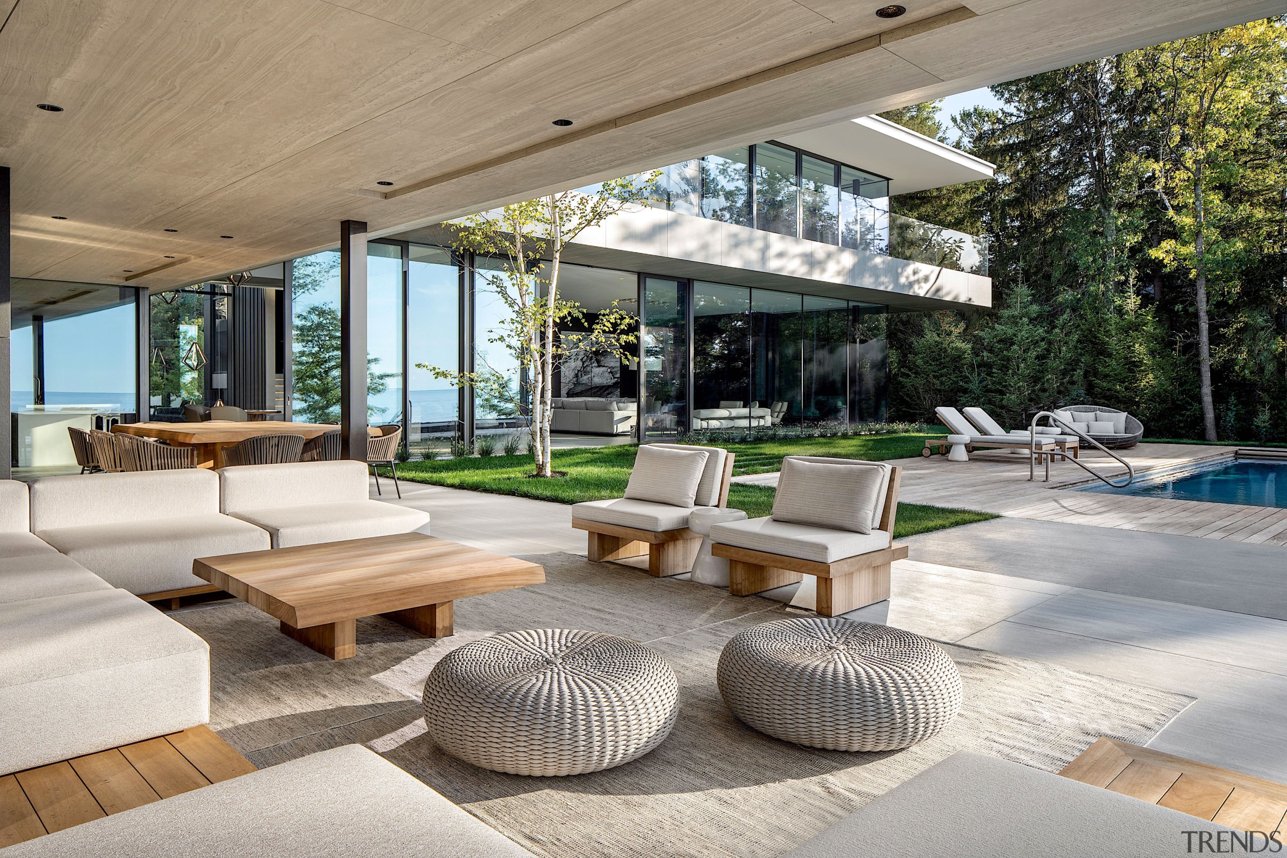 A covered outdoor entertainment area flanks a swimming 