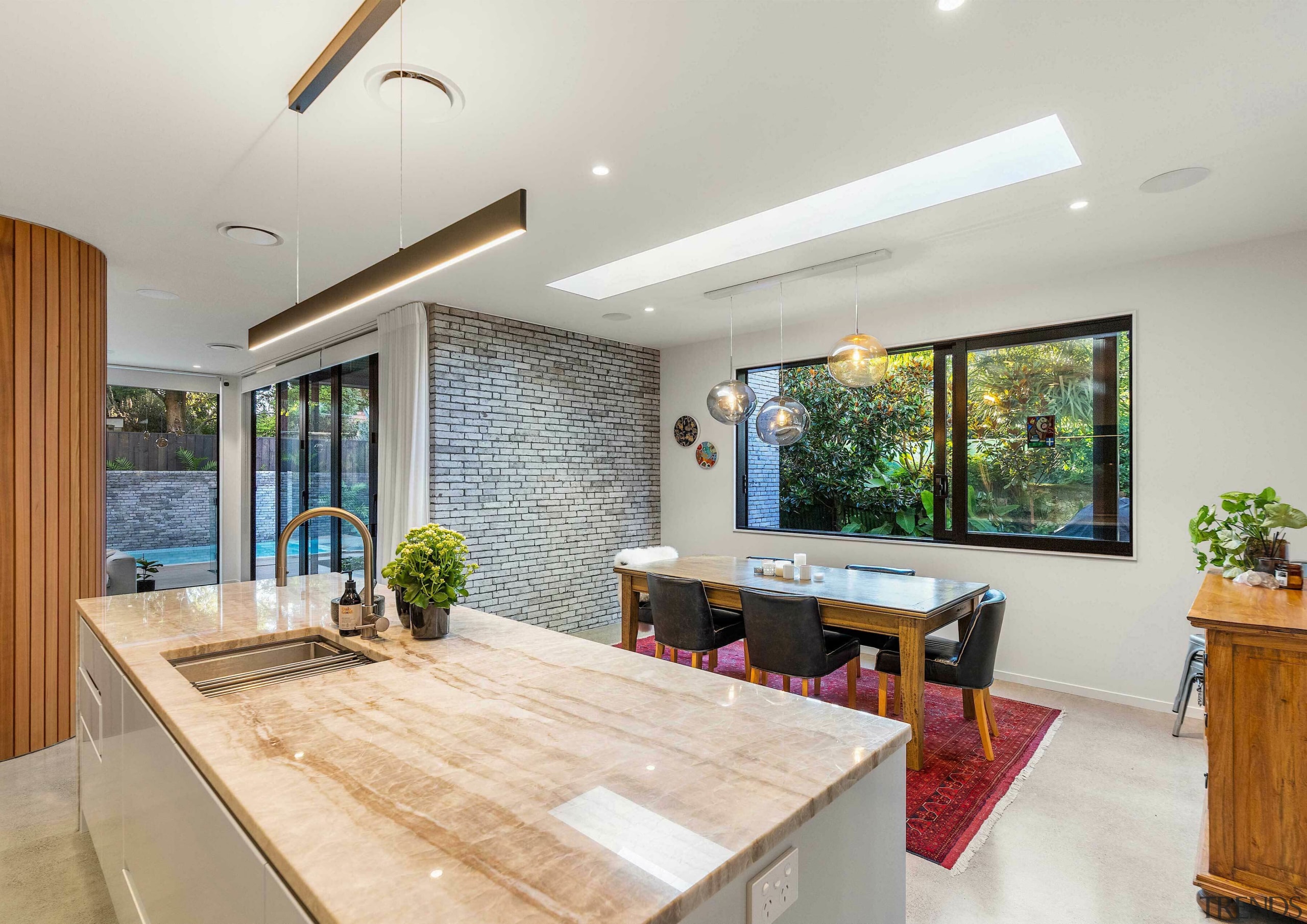 Kitchen looking through to pool and outdoor living. 