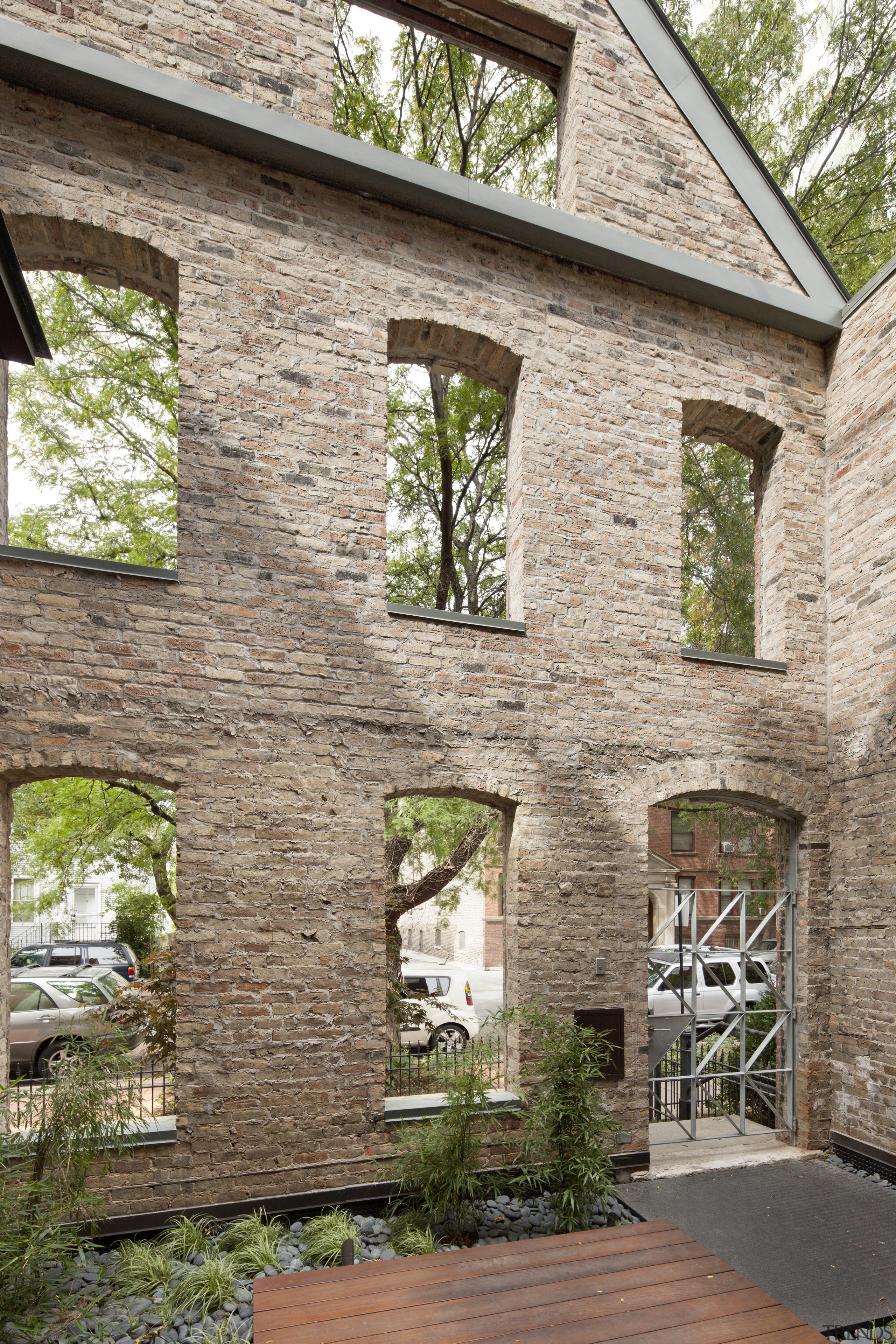 View of a renovated three-story home, built to brick, cottage, estate, facade, home, house, property, real estate, window, brown, gray