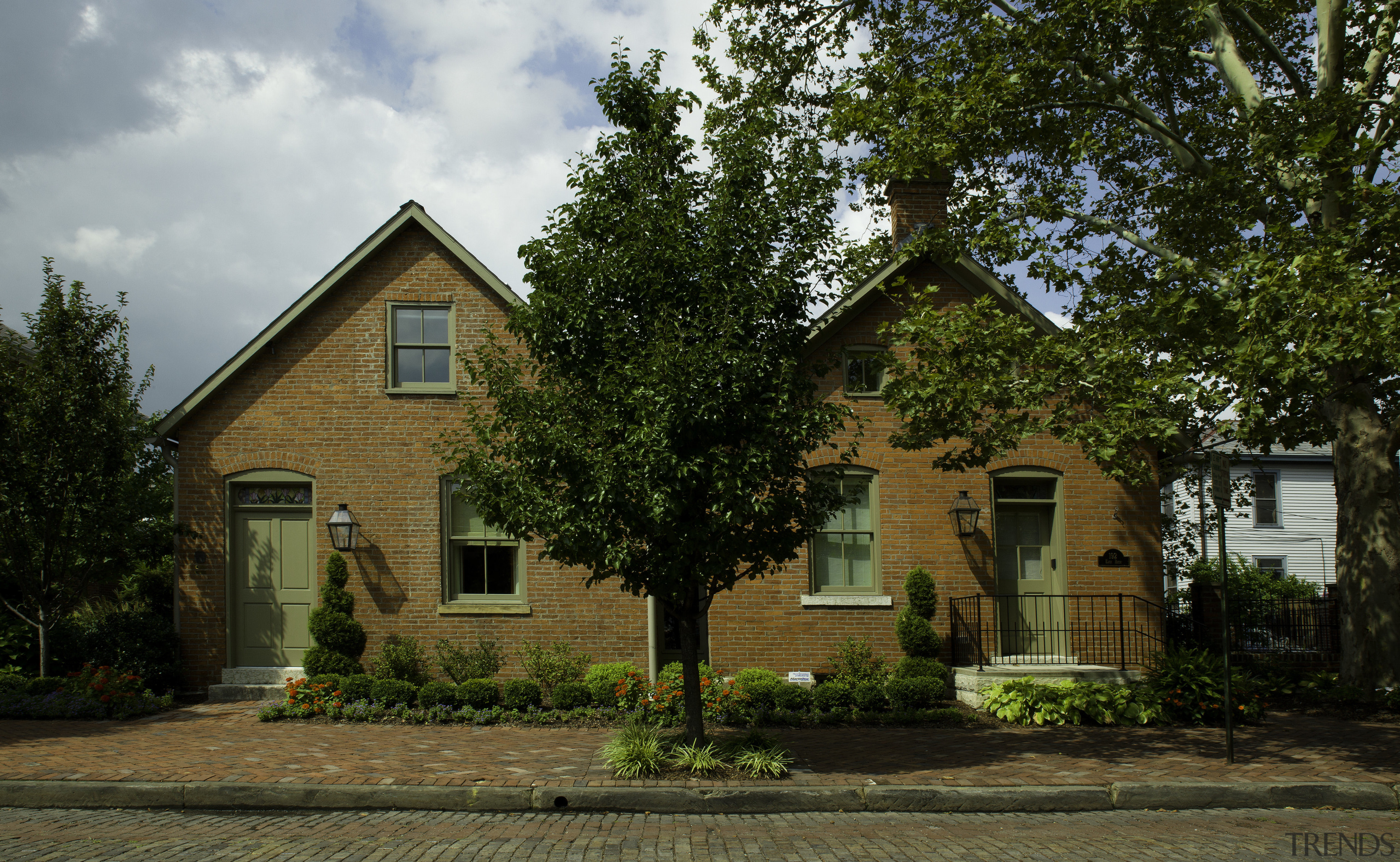This is a home designed by John Behal cottage, estate, facade, farmhouse, home, house, neighbourhood, plantation, property, real estate, residential area, suburb, tree, brown