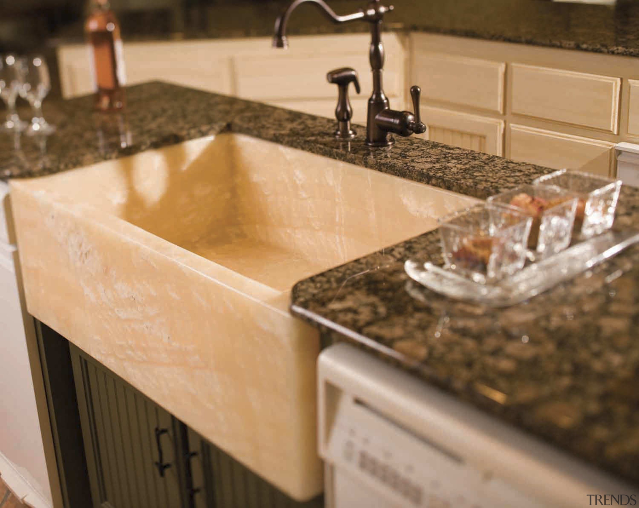 De La Fontera can custom design and handcraft countertop, granite, kitchen, sink, orange, brown