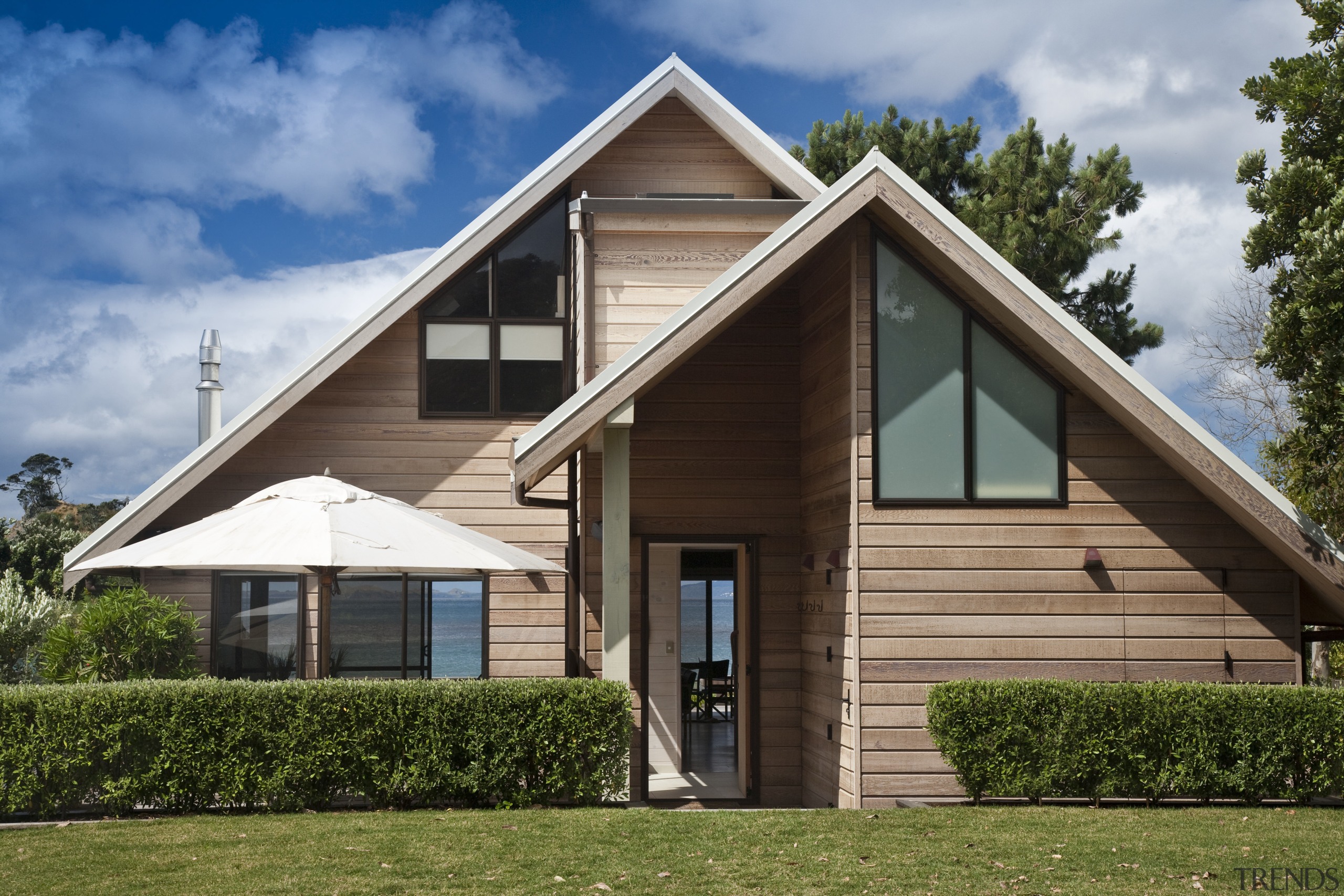 View of renovated beach house designed by architect architecture, cottage, elevation, facade, farmhouse, home, house, property, real estate, residential area, siding, brown