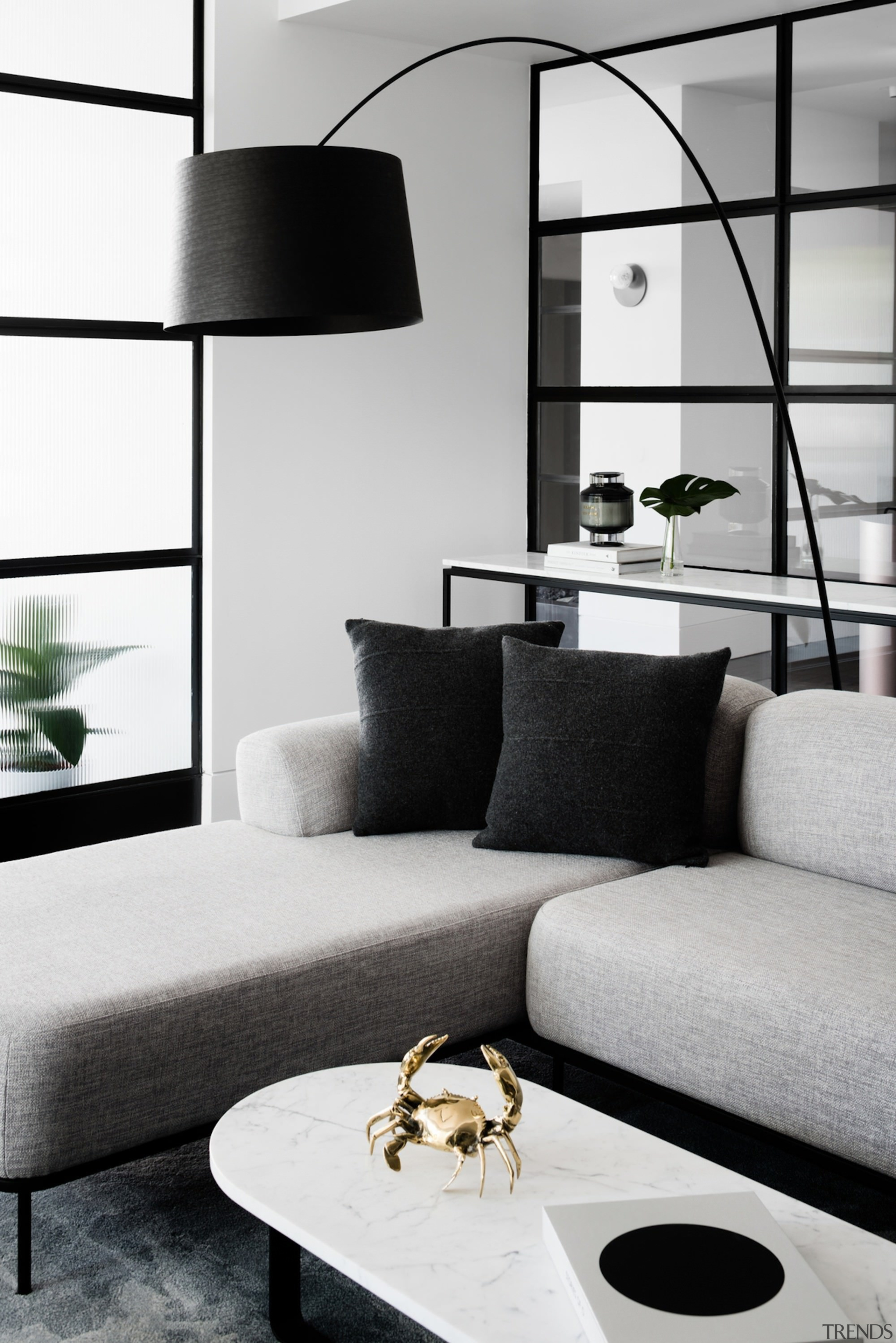 This apartment is as much about the fittings black and white, coffee table, couch, furniture, home, interior design, living room, product design, table, white, black