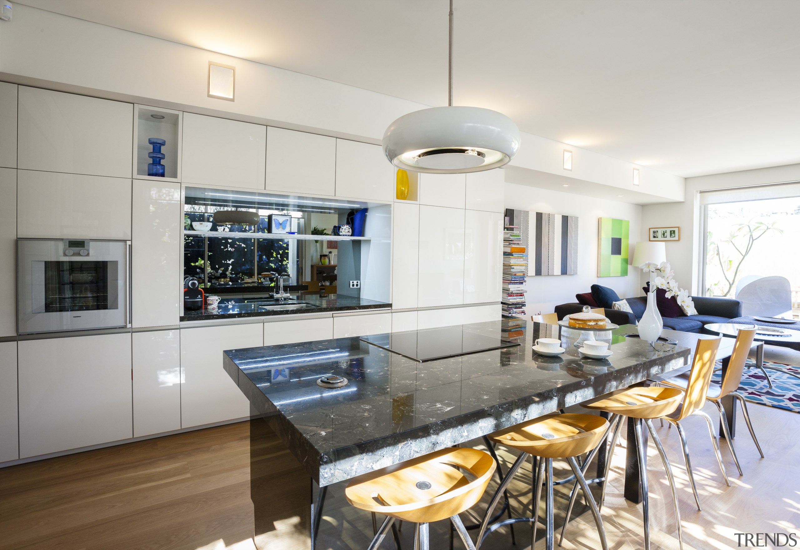 A reflective smoked mirror glass splashback and island countertop, interior design, kitchen, real estate, white