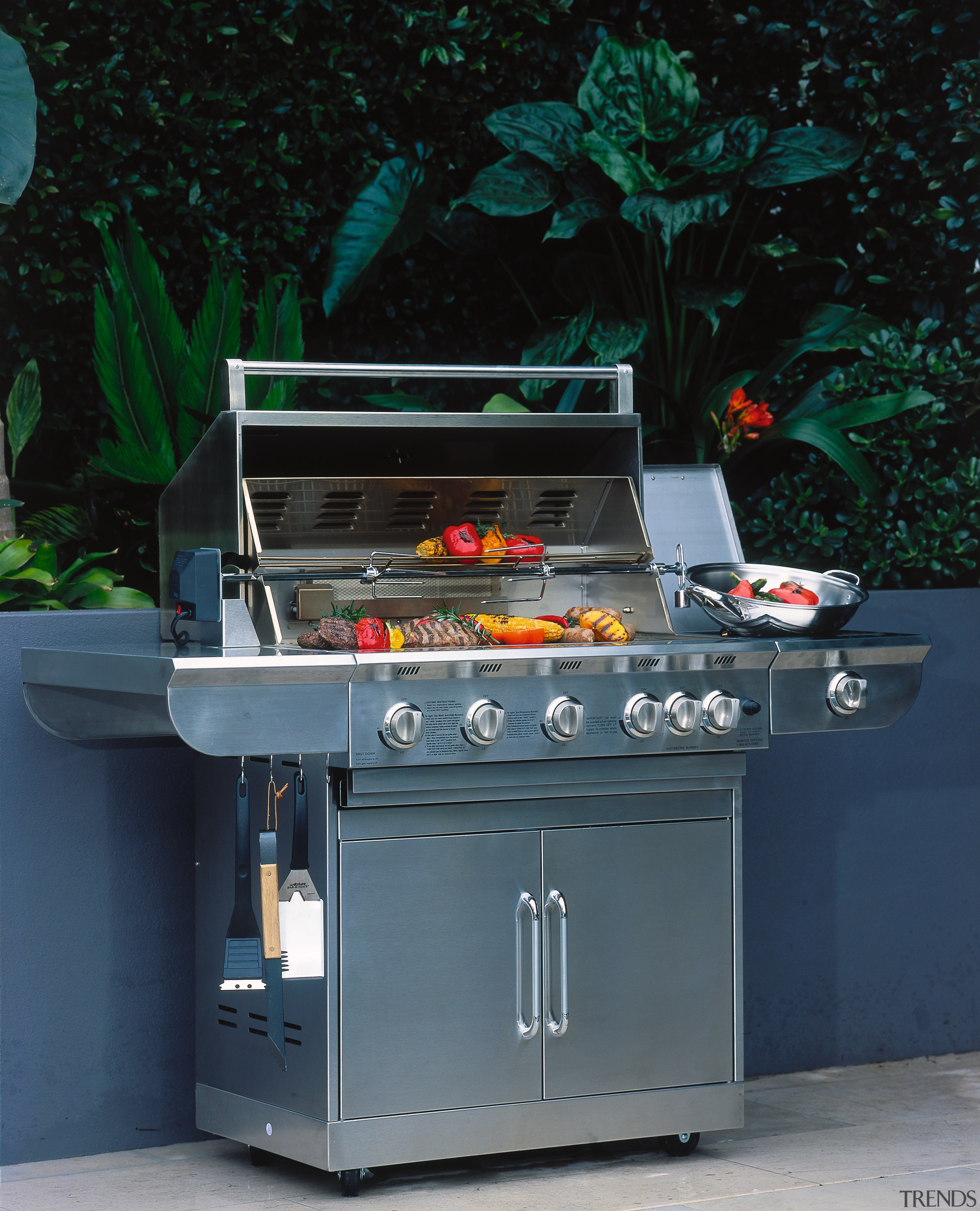 Stainless steel barbeque in outdoor living area with barbecue, barbecue grill, kitchen appliance, outdoor grill, black