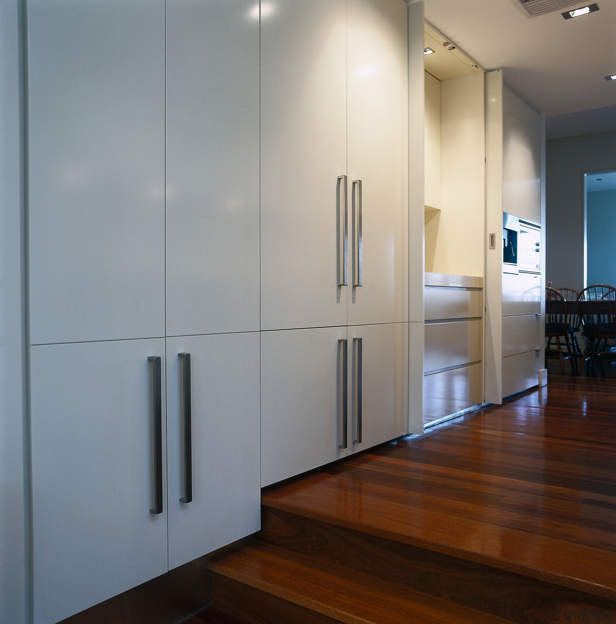 view of the polyurethane finished cabinetry and polished cabinetry, floor, flooring, glass, interior design, wall, gray