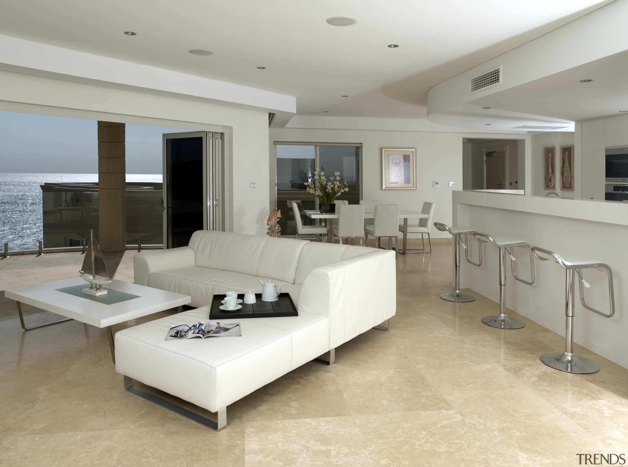 A view of floor-to-ceiling windows which maximise the ceiling, floor, flooring, interior design, living room, property, real estate, room, table, wood flooring, gray