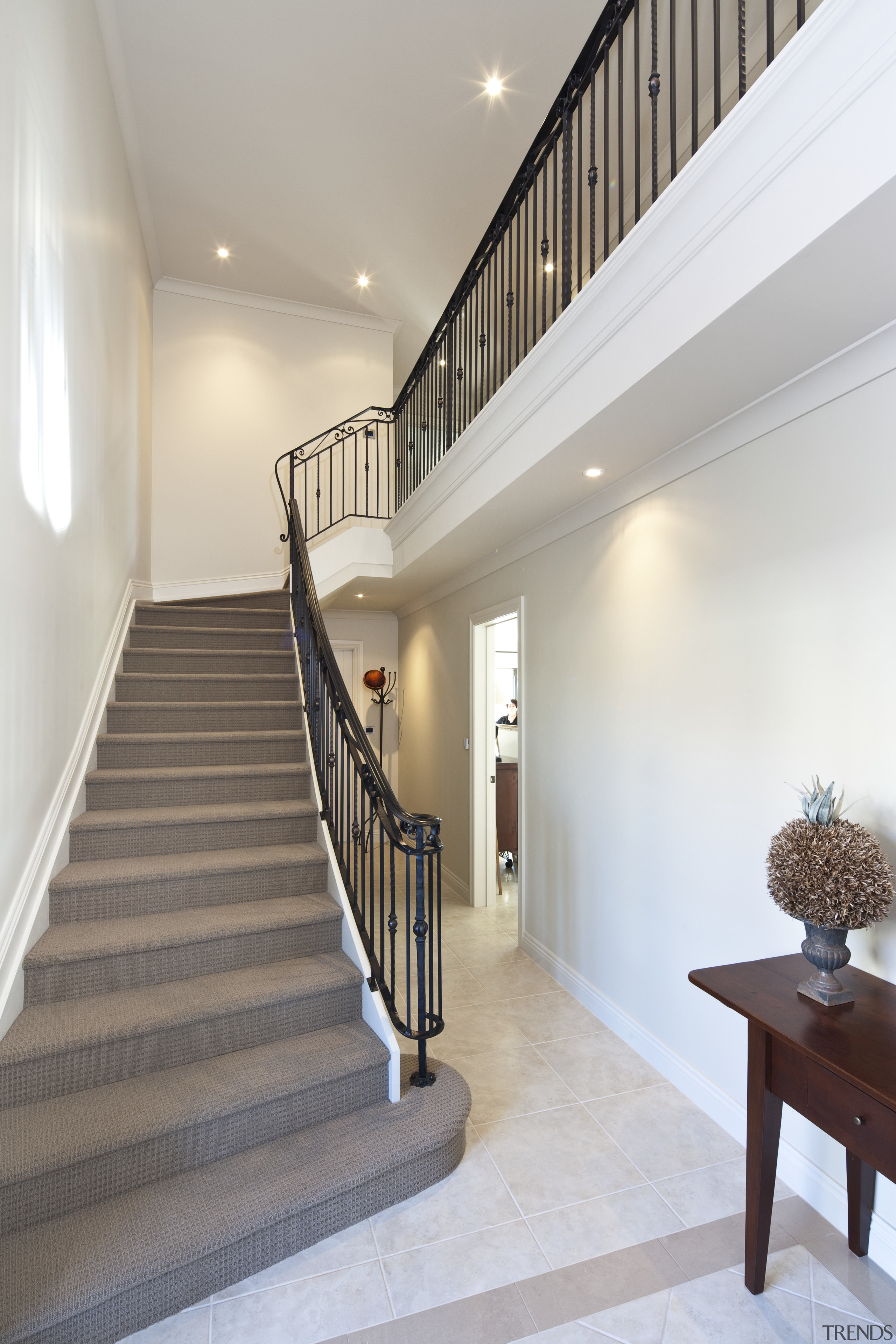 View of stairway which features iron balustrade and architecture, baluster, ceiling, daylighting, estate, floor, flooring, handrail, home, house, interior design, real estate, stairs, gray, white