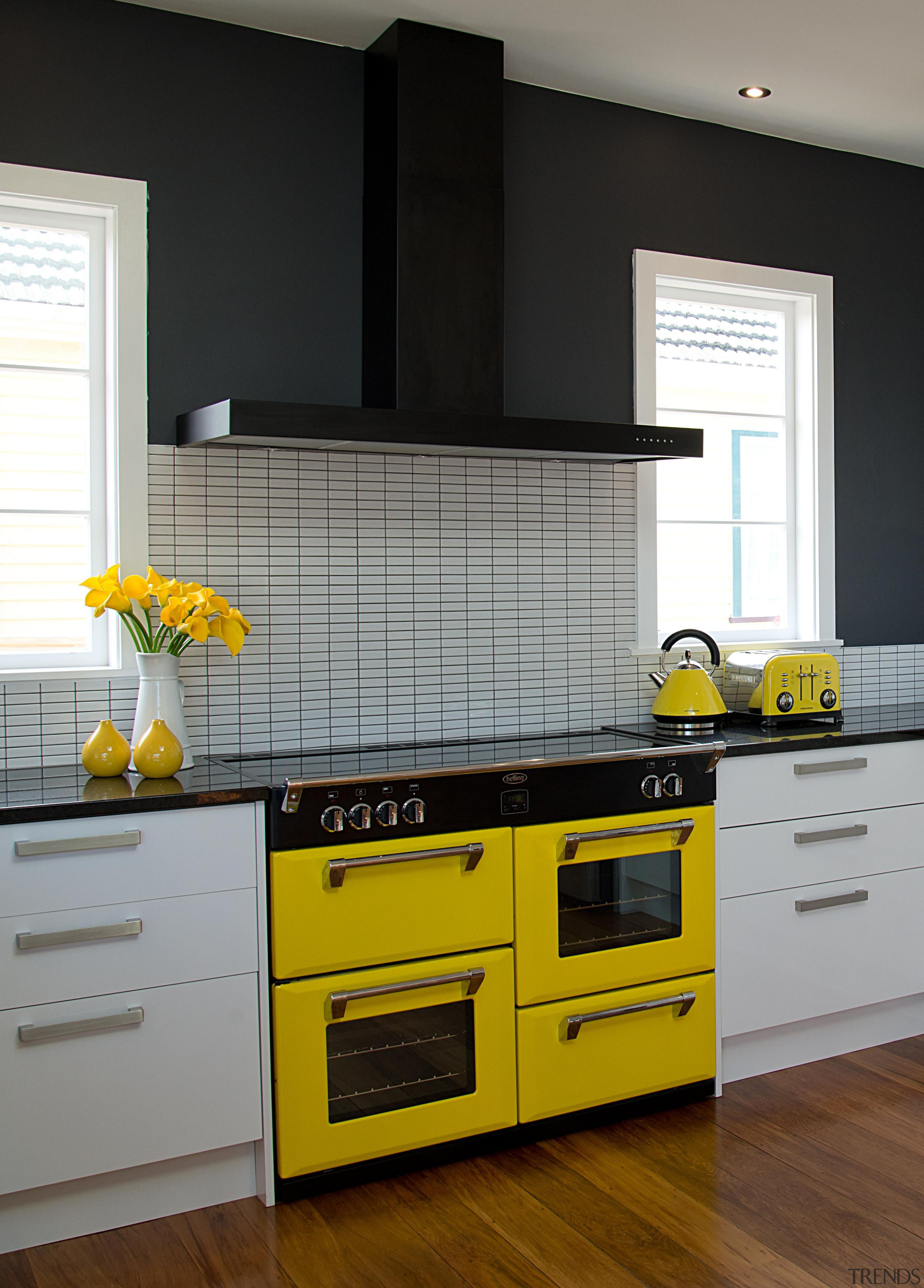 Beautiful Kitchen featuring a Yellow Belling Richmond Oven. cabinetry, countertop, cuisine classique, floor, hardwood, home, home appliance, interior design, kitchen, kitchen appliance, kitchen stove, room, yellow, gray, black