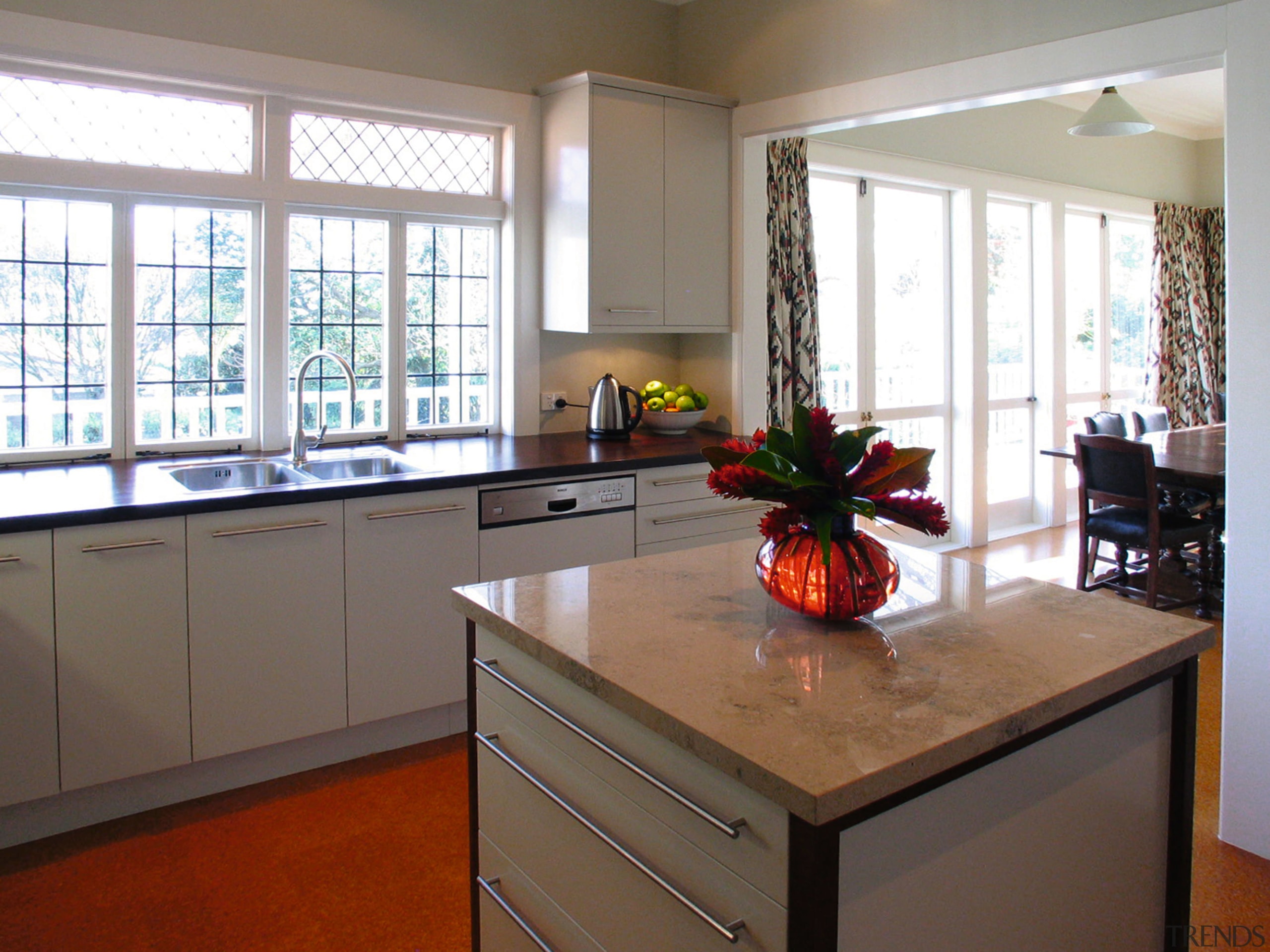 Kitchen with limestone top on island, white cabinetry, cabinetry, countertop, interior design, kitchen, real estate, room, window, white