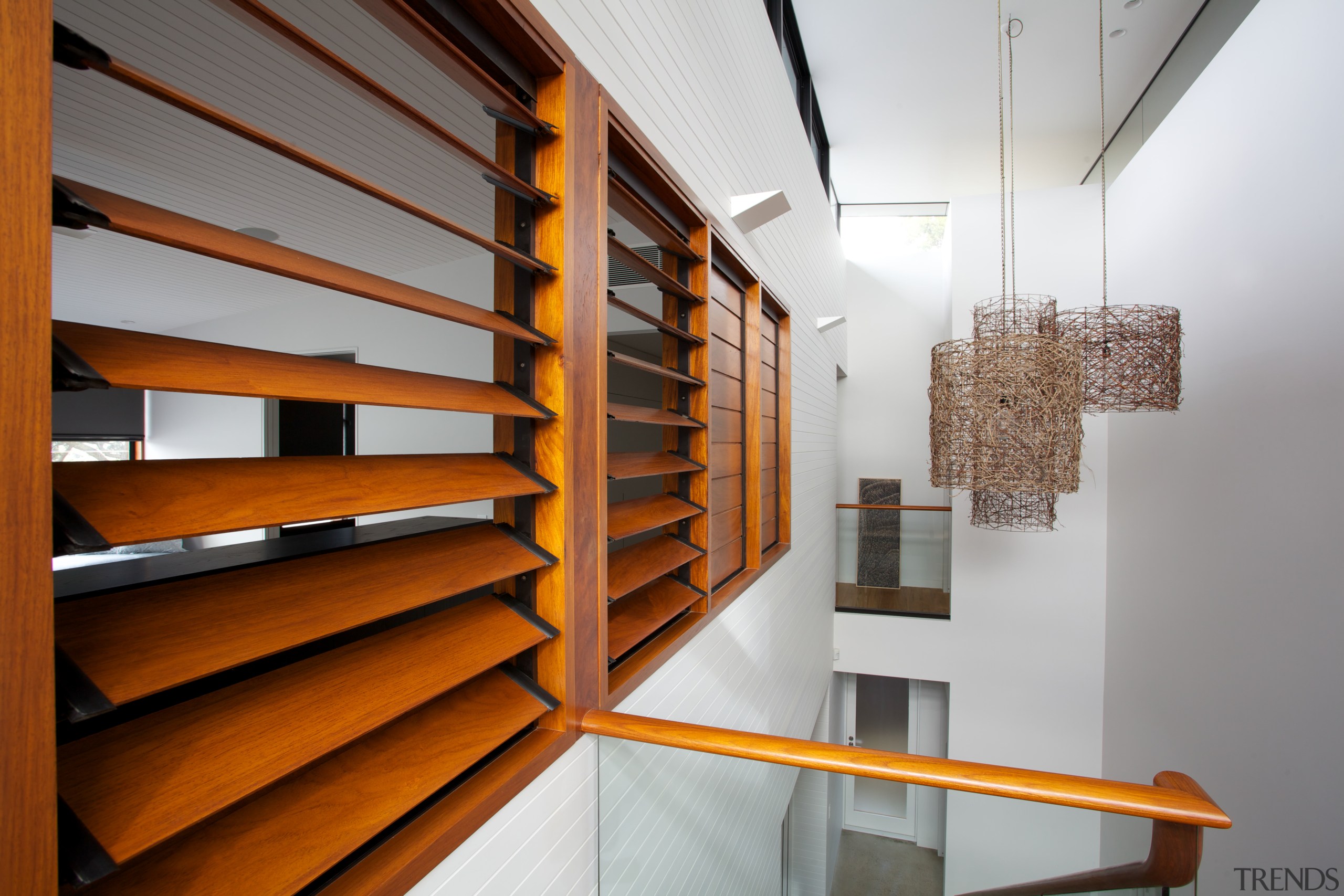 Detail of internal wooden louvres. - Detail of architecture, daylighting, handrail, interior design, shelf, shelving, stairs, wood, gray, brown