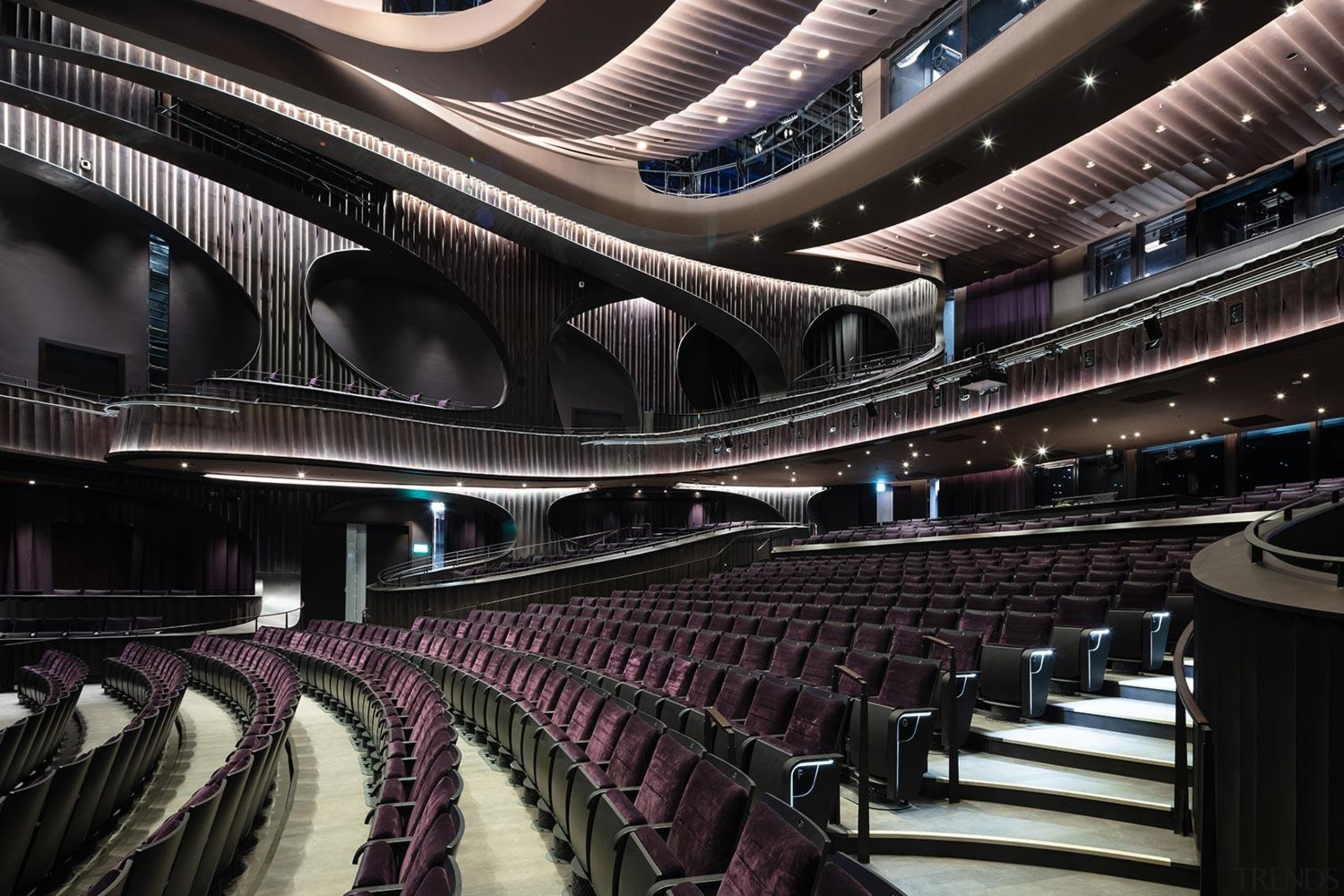 Conceived as a cultural sanctuary, the performance venue architecture, audience, auditorium, building, ceiling, concert hall, convention center, heater, interior design, musical instrument accessory, opera house, orchestra pit, performing arts center, stage, theatre, black