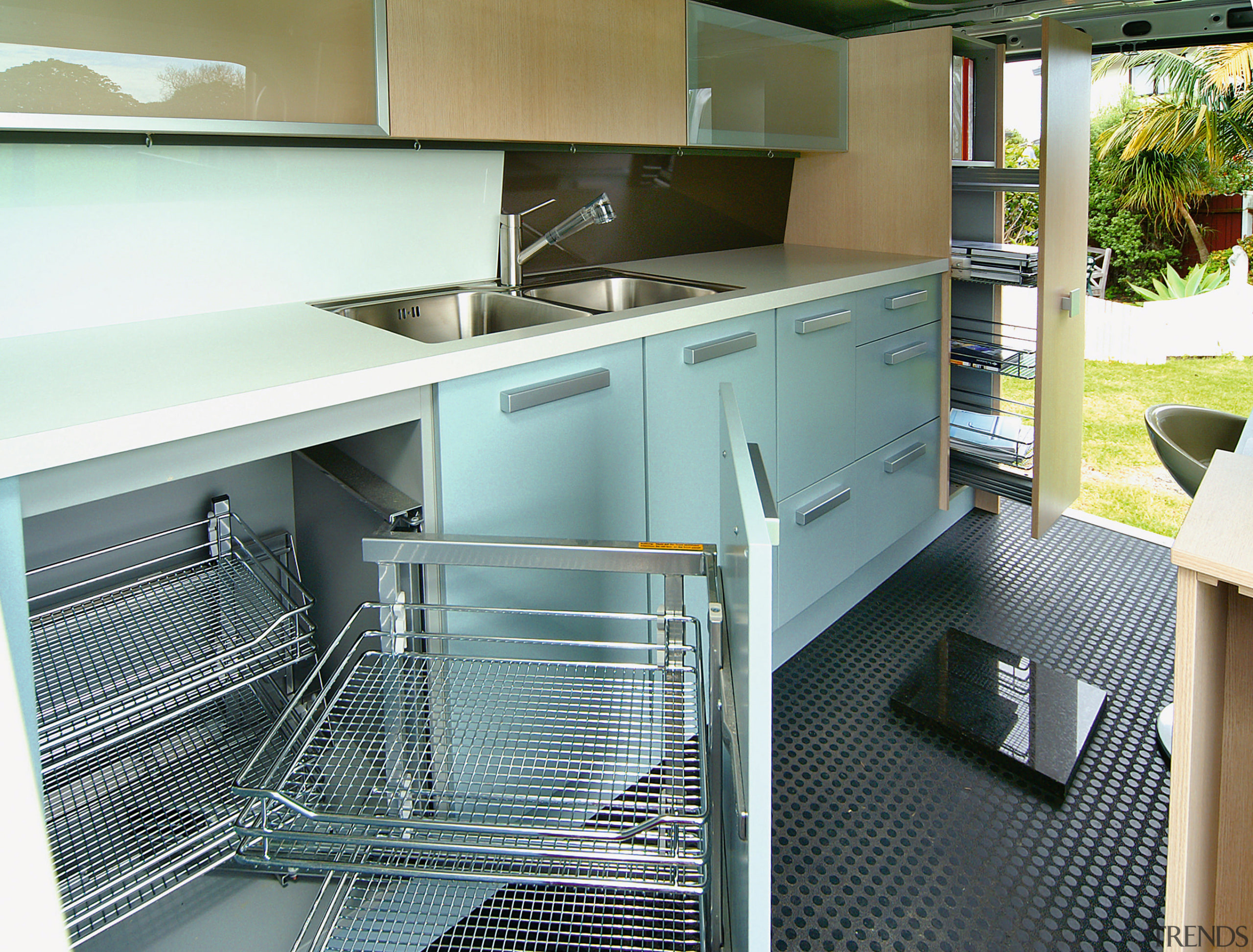 A view of a kitchen by the Mobile countertop, kitchen, white