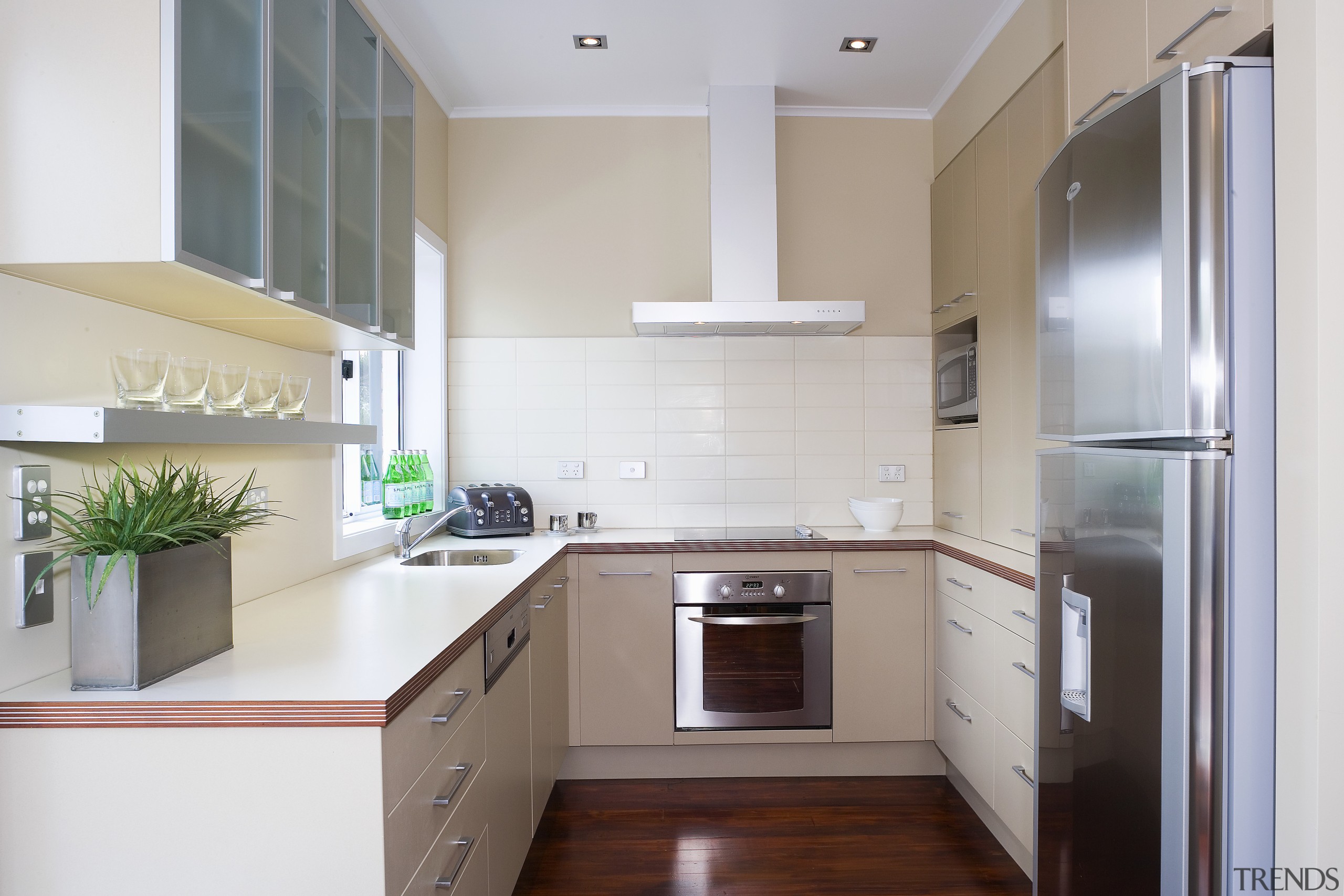 A view of a kitchen designed by YellowFox. cabinetry, countertop, cuisine classique, interior design, kitchen, property, real estate, room, gray, white