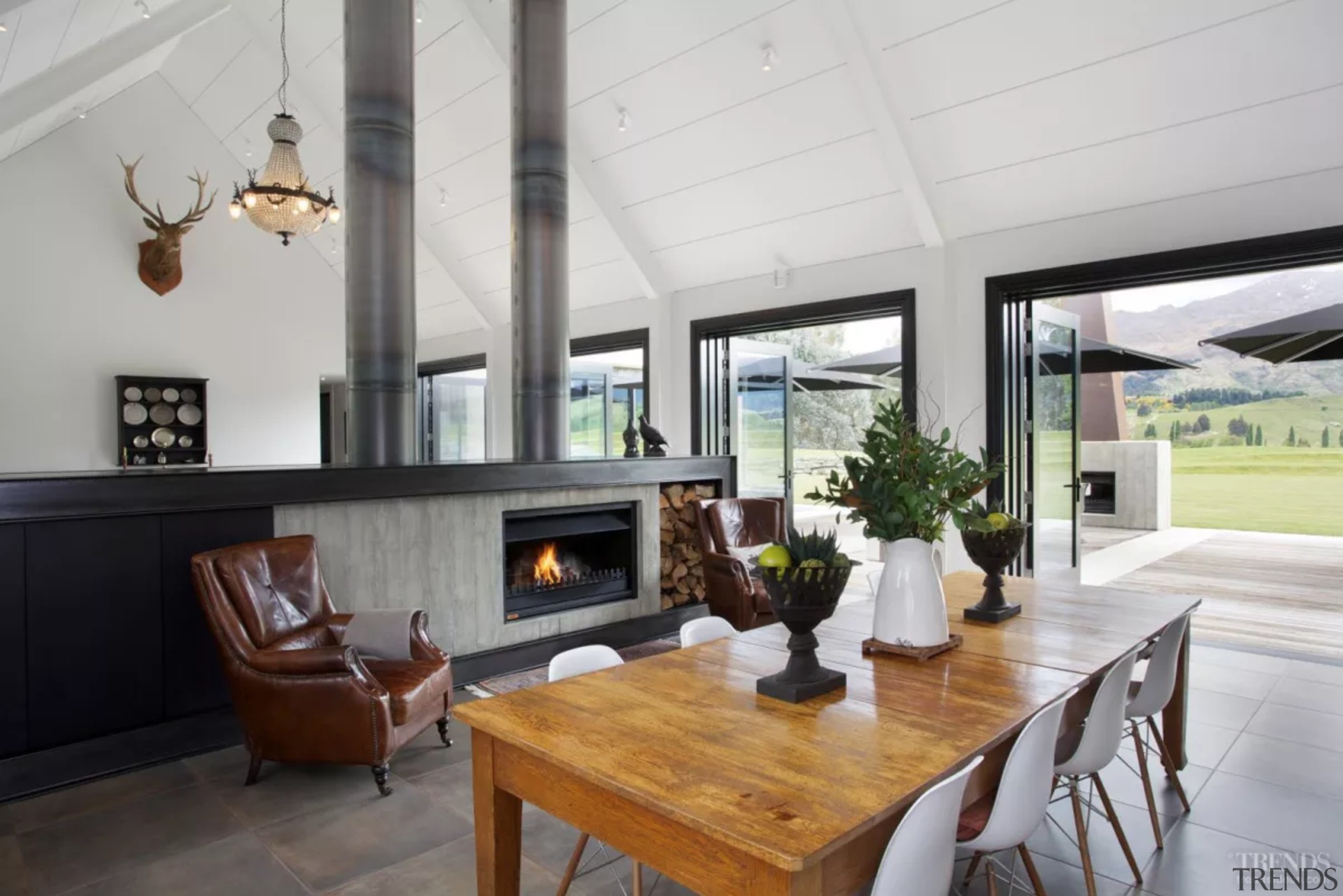 A long, low wall framed in blackened steel house, interior design, living room, property, real estate, gray