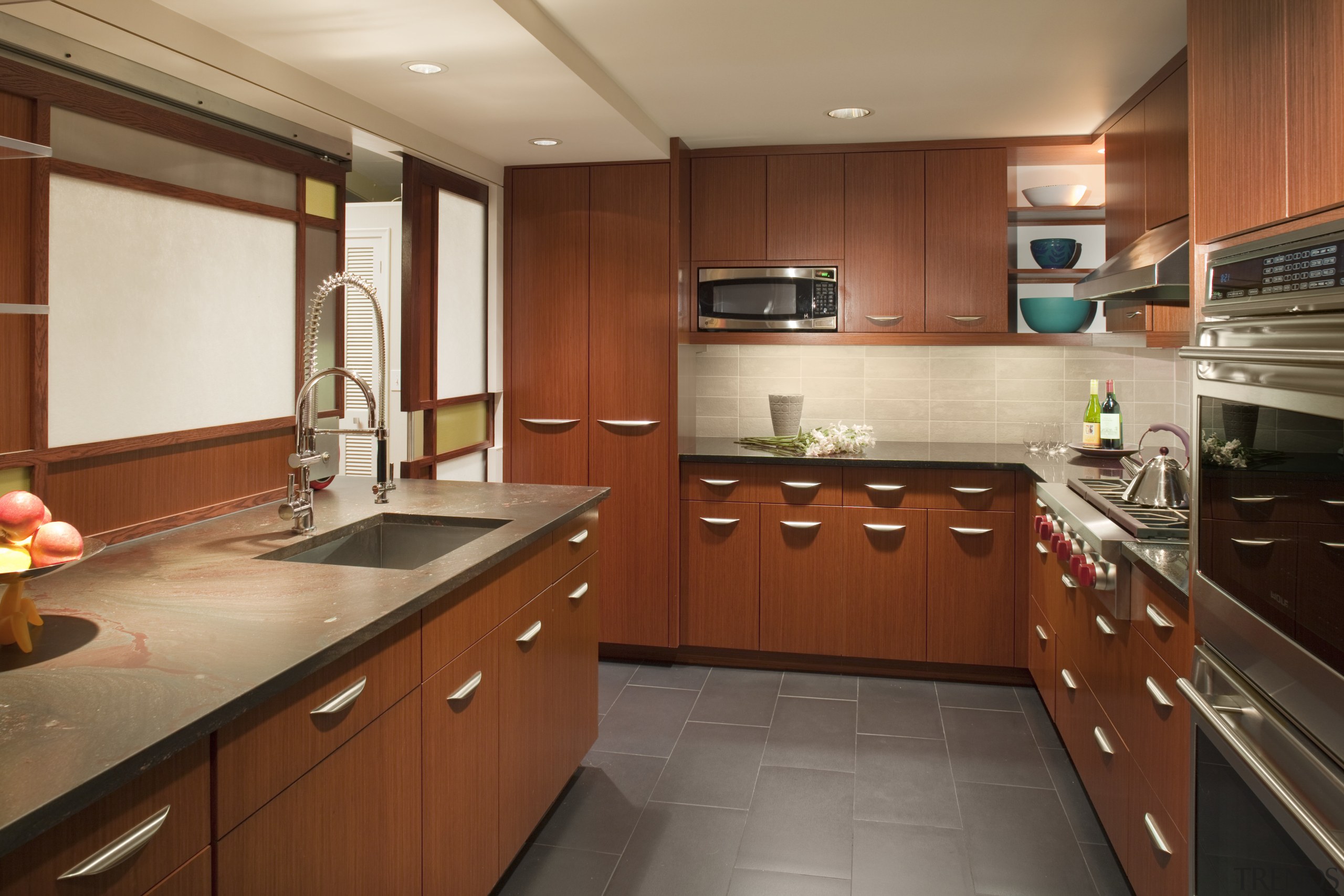 dark stone tile floors, wooden cabinets with pull cabinetry, countertop, cuisine classique, interior design, kitchen, property, real estate, room, brown, orange