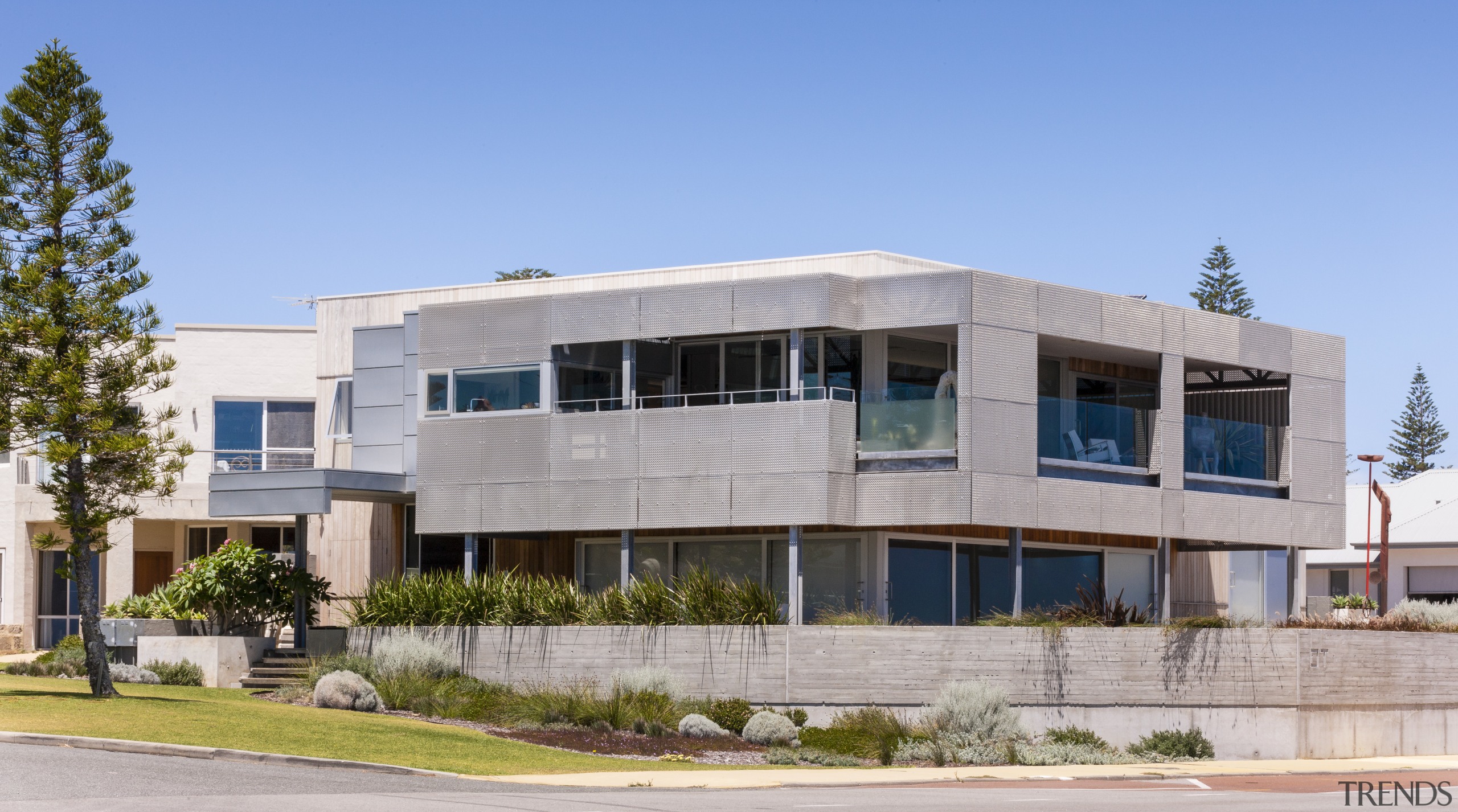 Materials for the renovation of this beachfront home apartment, architecture, building, commercial building, corporate headquarters, elevation, facade, home, house, mixed use, neighbourhood, property, real estate, residential area, gray, teal