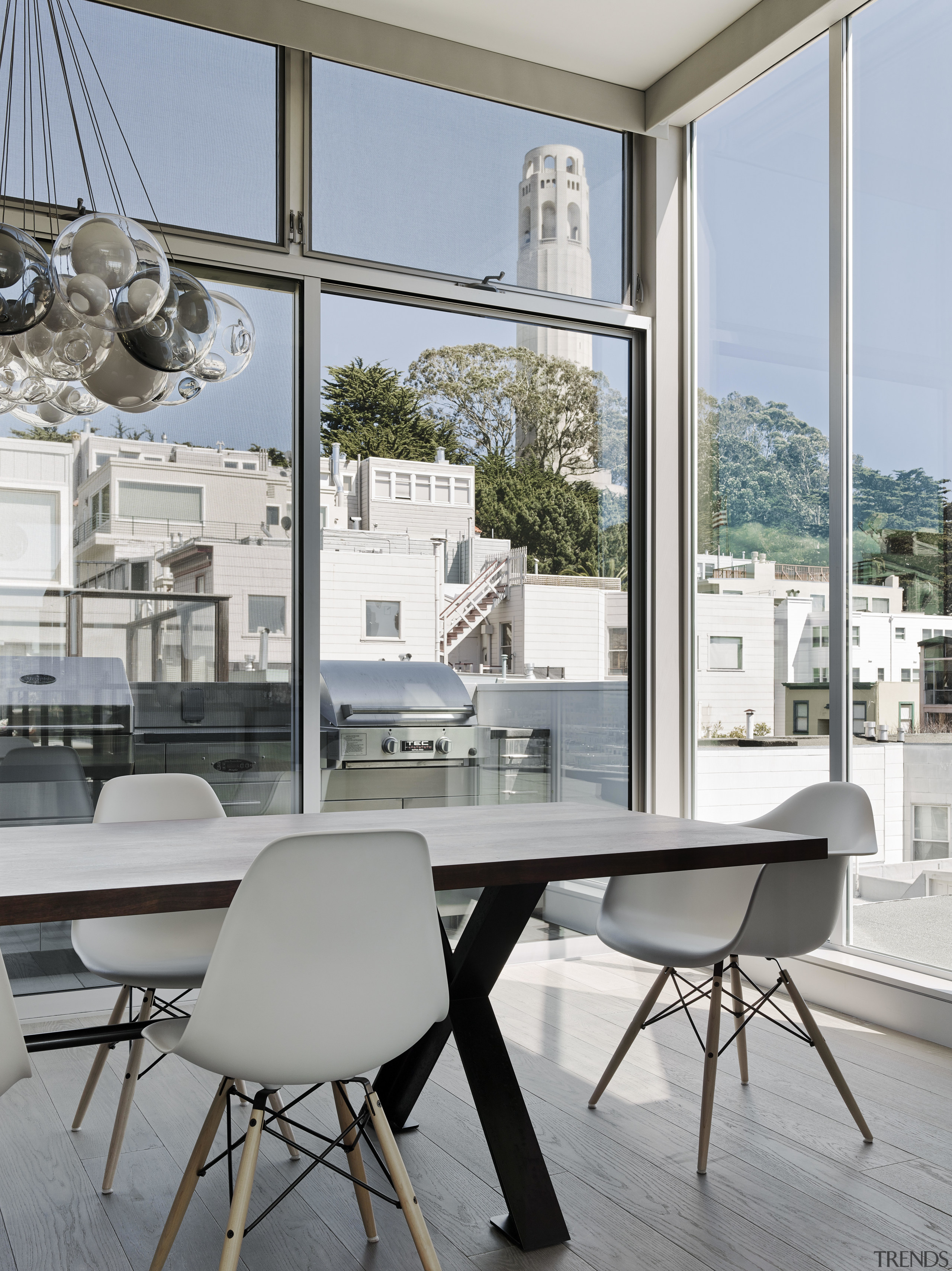 This dining area opens out to the rear architecture, chair, furniture, home, interior design, table, window, gray