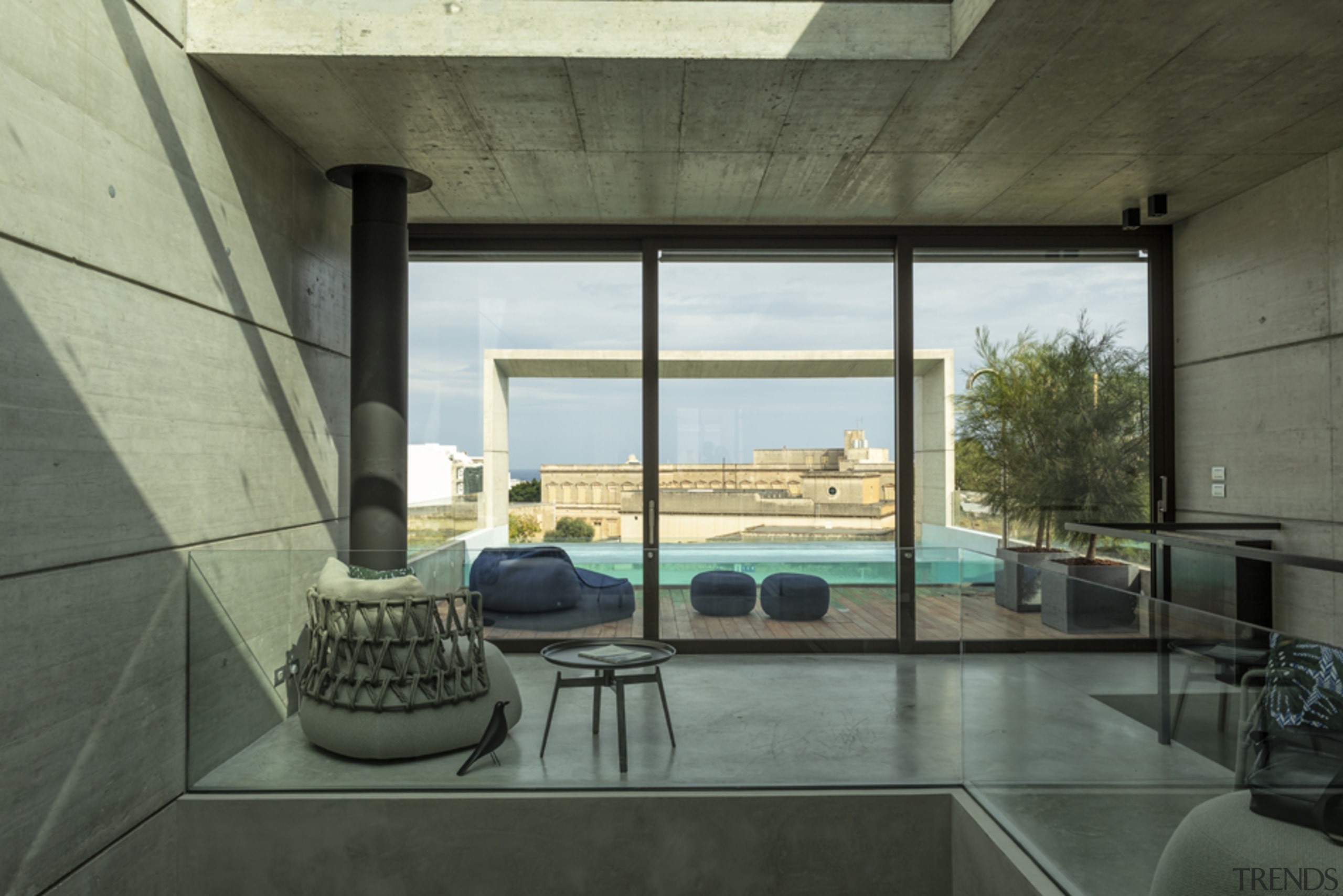 The view from the kitchen across to the architecture, building, ceiling, concrete, daylighting, floor, flooring, furniture, glass, home, house, interior design, living room, loft, property, real estate, room, shade, table, window, black, gray